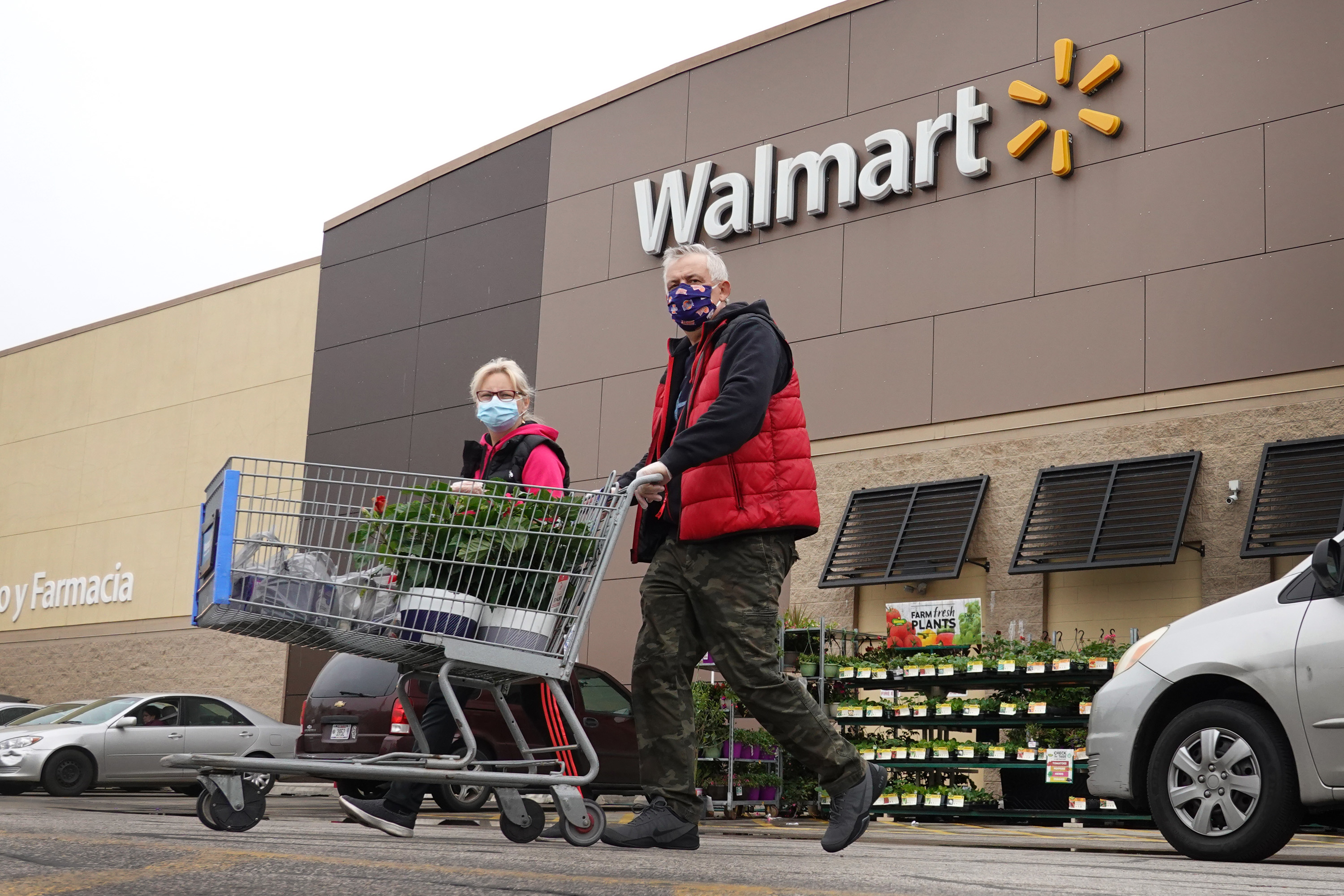 CHICAGO, ILLINOIS - MAY 19: Customers shop at a Walmart store on May 19, 2020 in Chicago, Illinois. Walmart reported a 74% increase in U.S. online sales for the quarter that ended April 30, and a 10% increase in same store sales for the same period as the effects of the coronavirus helped to boost sales. (Photo by Scott Olson/Getty Images)