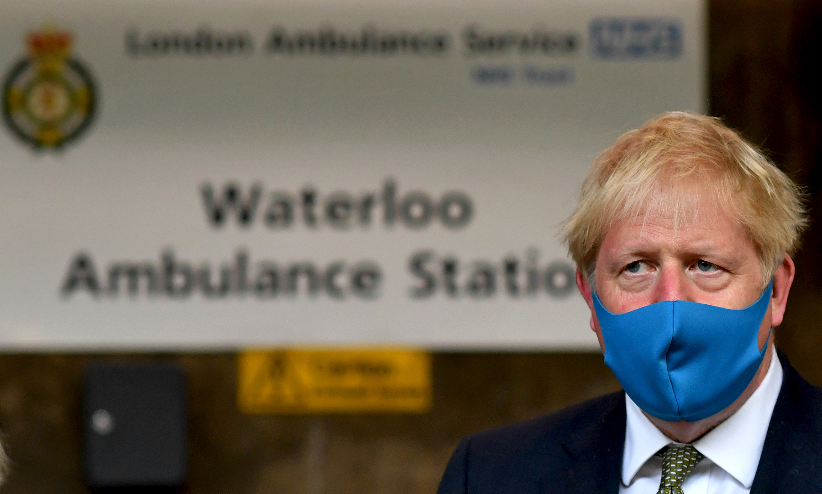 LONDON, UNITED KINGDOM - JULY 13: Britain's Prime Minister Boris Johnson, wearing a face mask or covering due to the COVID-19 pandemic, reacts during his visit to the headquarters of the London Ambulance Service NHS Trust on July 13, 2020 in London, England. (Photo by Ben Stansall-WPA Pool/Getty Images)