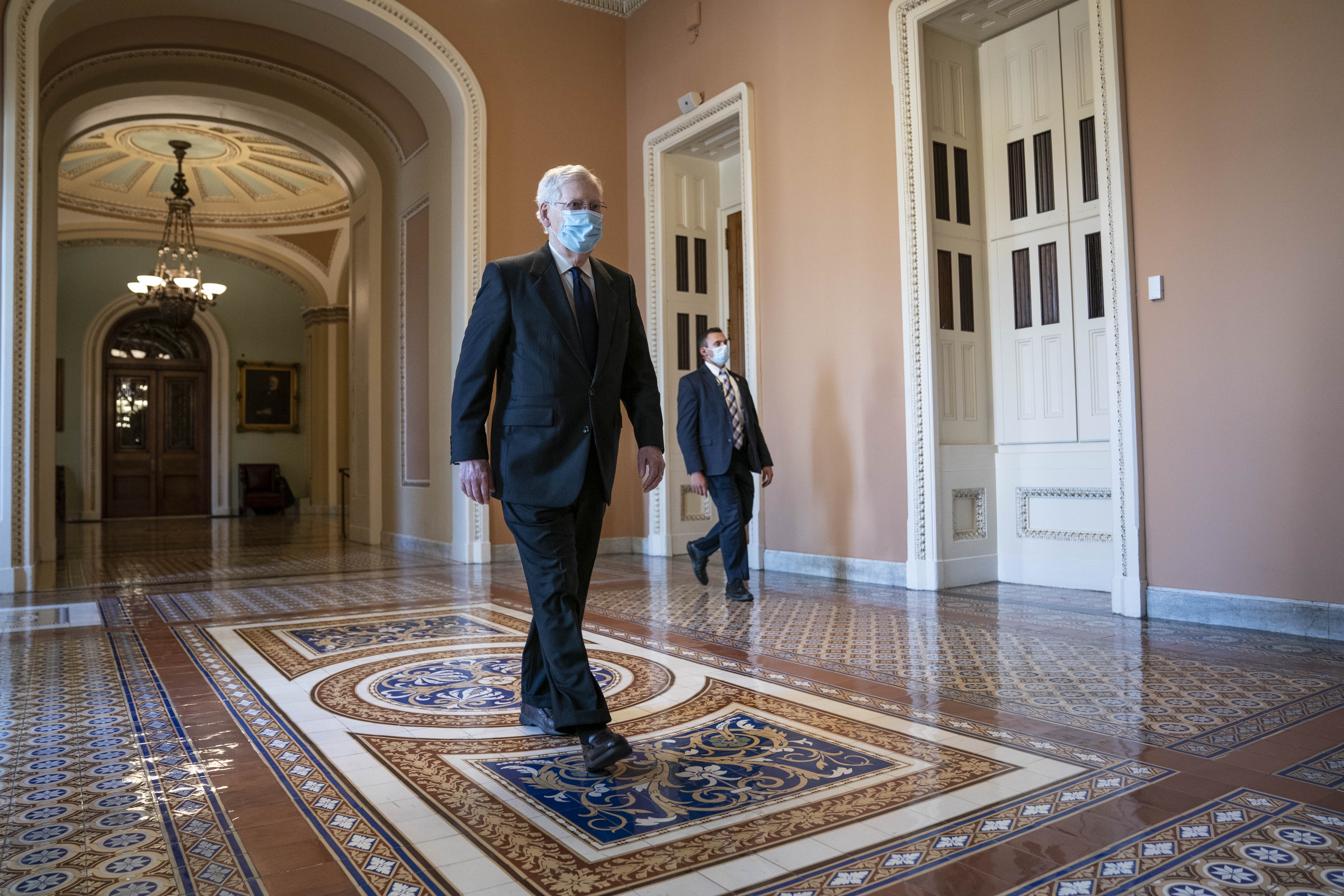 Senate Majority Leader Mitch McConnell, a Republican from Kentucky, wears a protective mask while arriving to the U.S. Capitol in Washington, D.C., U.S., on Monday, July 27, 2020. McConnell is expected to release a $1 trillion pandemic relief proposal today, kicking off talks with Democrats on provisions including money for people who've lost their jobs and protections for employers reopening their businesses.  Sarah Silbiger/Bloomberg via Getty Images