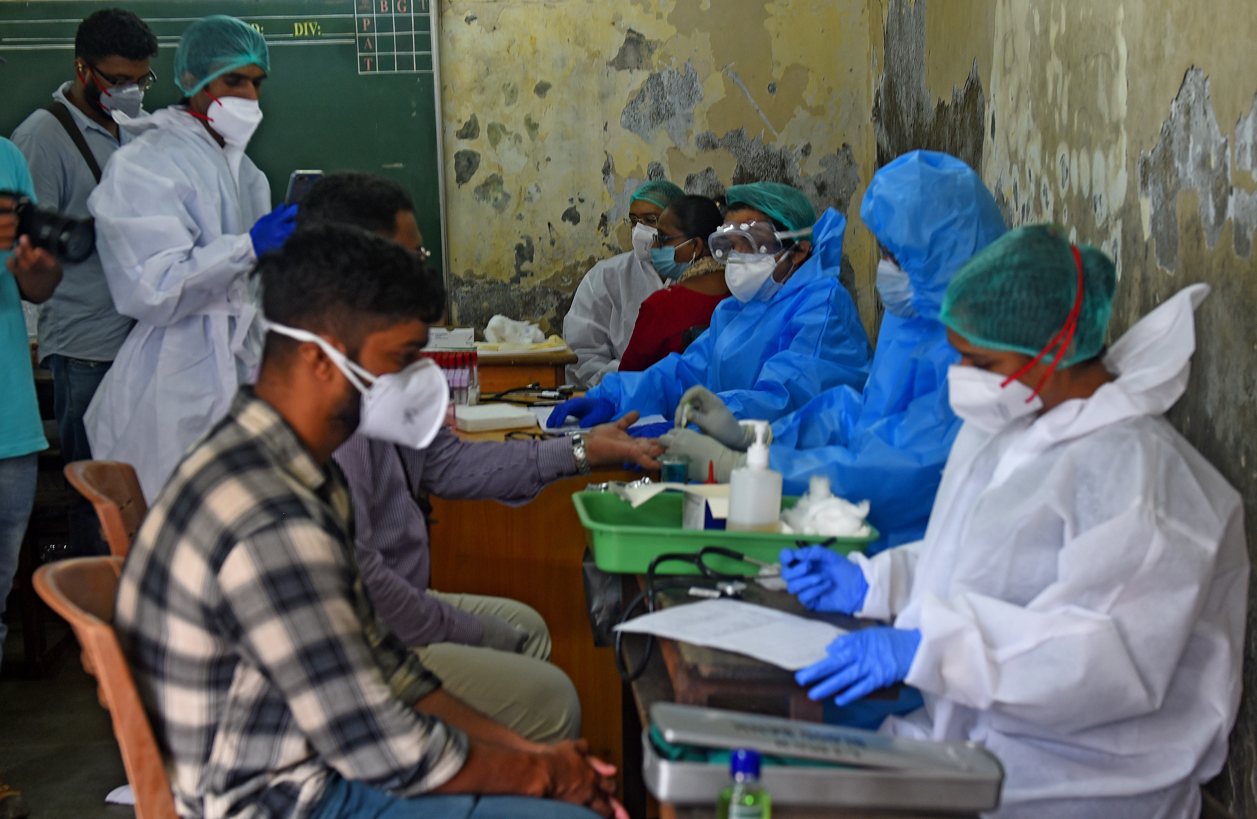 MUMBAI, INDIA -JULY 27: BMC health workers collect plasma samples from patients who recovered from Covid-19 at Dharavi, on July 27, 2020 in Mumbai, India. (Photo by Vijayanand Gupta/Hindustan Times via Getty Images)