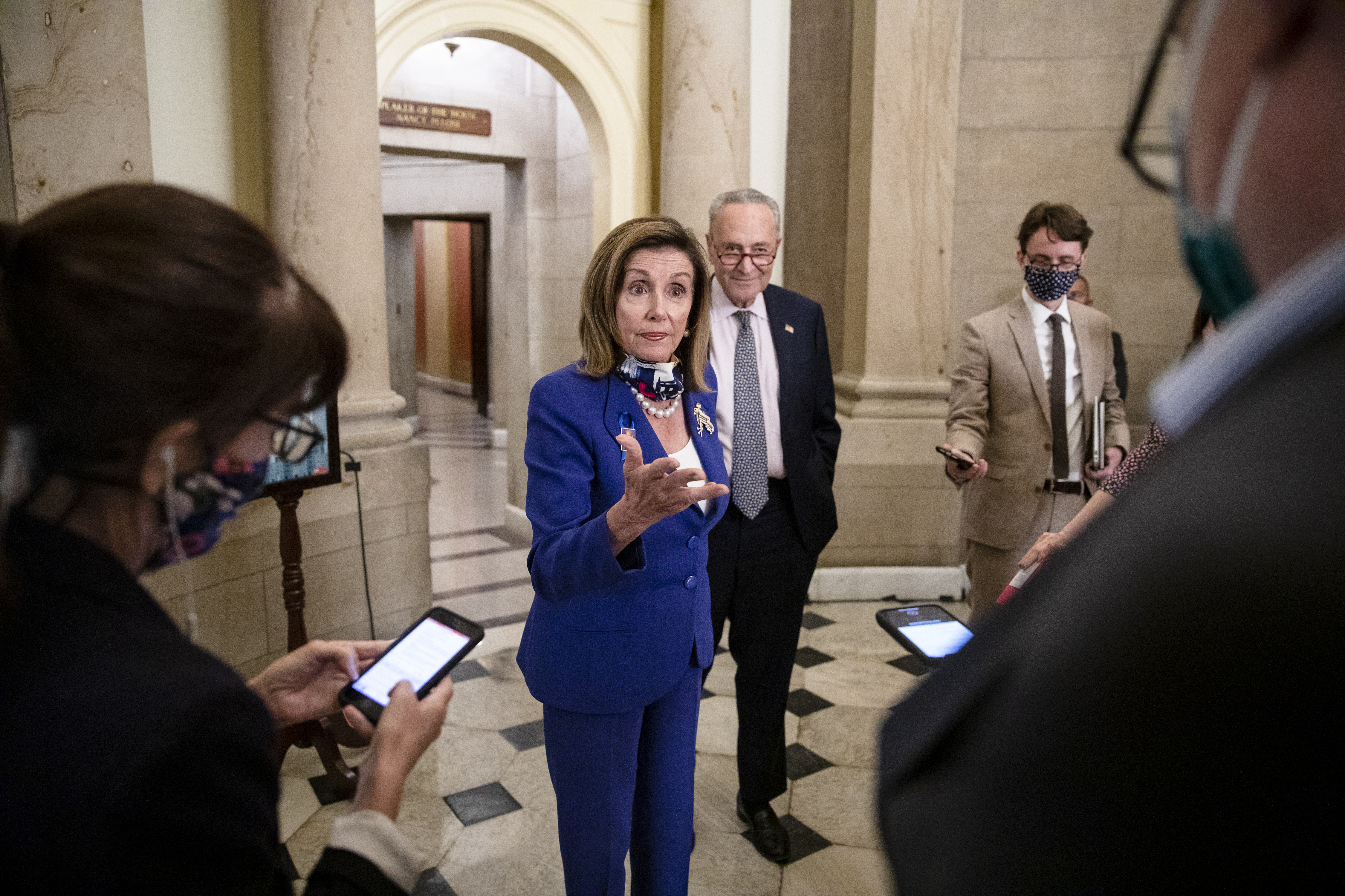 WASHINGTON, DC - JULY 30: Speaker of the House Nancy Pelosi (D-CA) (L) and Senate Minority Leader Chuck Schumer (D-NY) (R) speak to reporters outside of Speaker Pelosis office following a meeting with U.S. Treasury Secretary Steven Mnuchin and White House Chief of Staff Mark Meadows on the eve of the expiration of the CARES Act on July 30, 2020 in Washington, DC. Congressional leadership and White House officials are continuing negotiations on a new relief package for Americans affected by the coronavirus pandemic and the economic recession it has caused but both sides have said that they are still far apart on what that package will include. (Photo by Samuel Corum/Getty Images)
