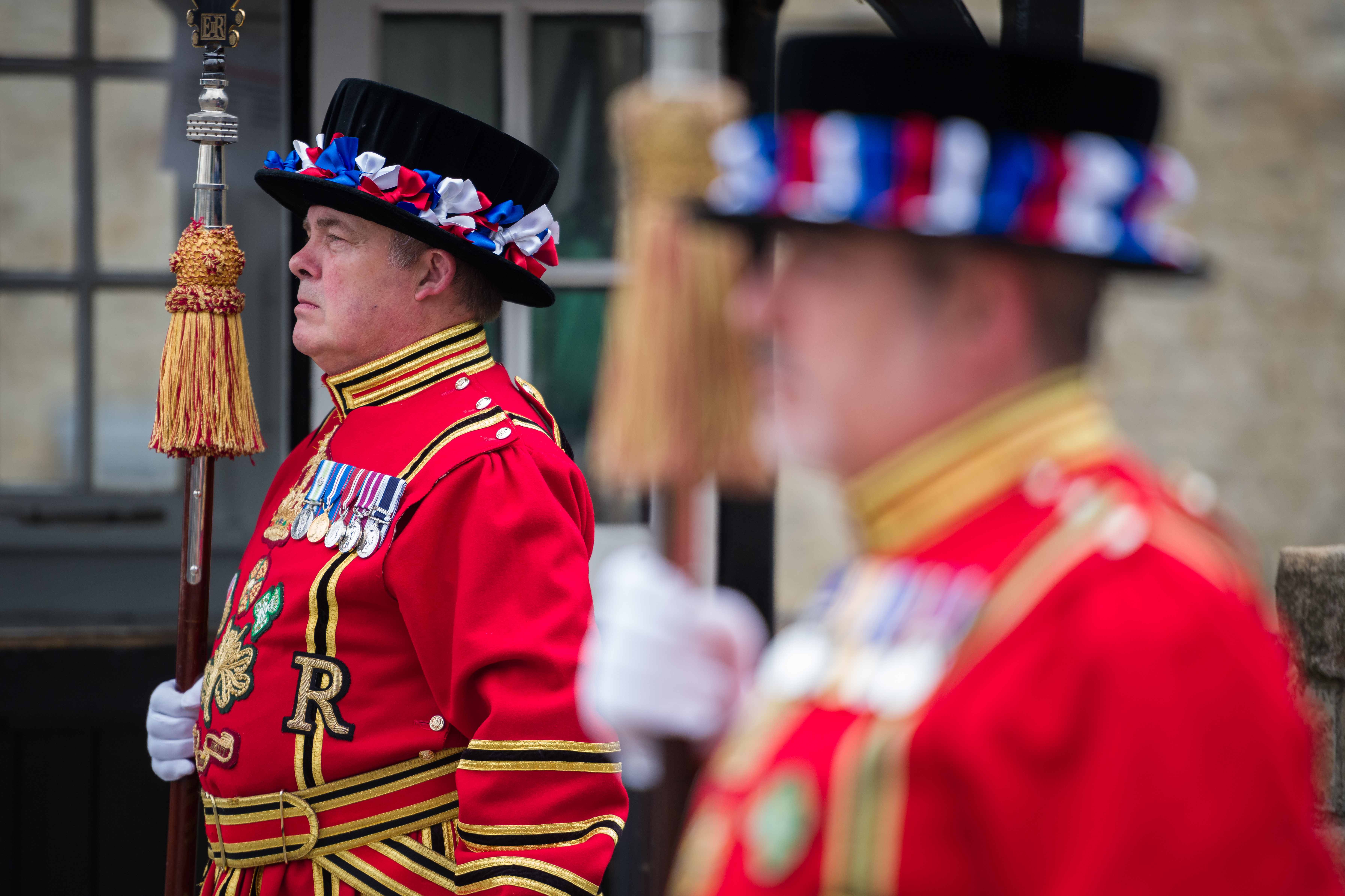 LONDON, ENGLAND - JULY 10: Yeoman Warders, commonly known as Beefeaters, stand to attention after crossing the Middle Drawbridge during a ceremonial event to mark the reopening to the public of the Tower of London on July 10, 2020 in London, England. As the British Government continues to relax the Coronavirus restrictions, tourism hotspots such as the Tower of London are reopening their doors, hoping to draw in visitors on the opportunity to see the sights during these much quieter times. (Photo by Leon Neal/Getty Images)