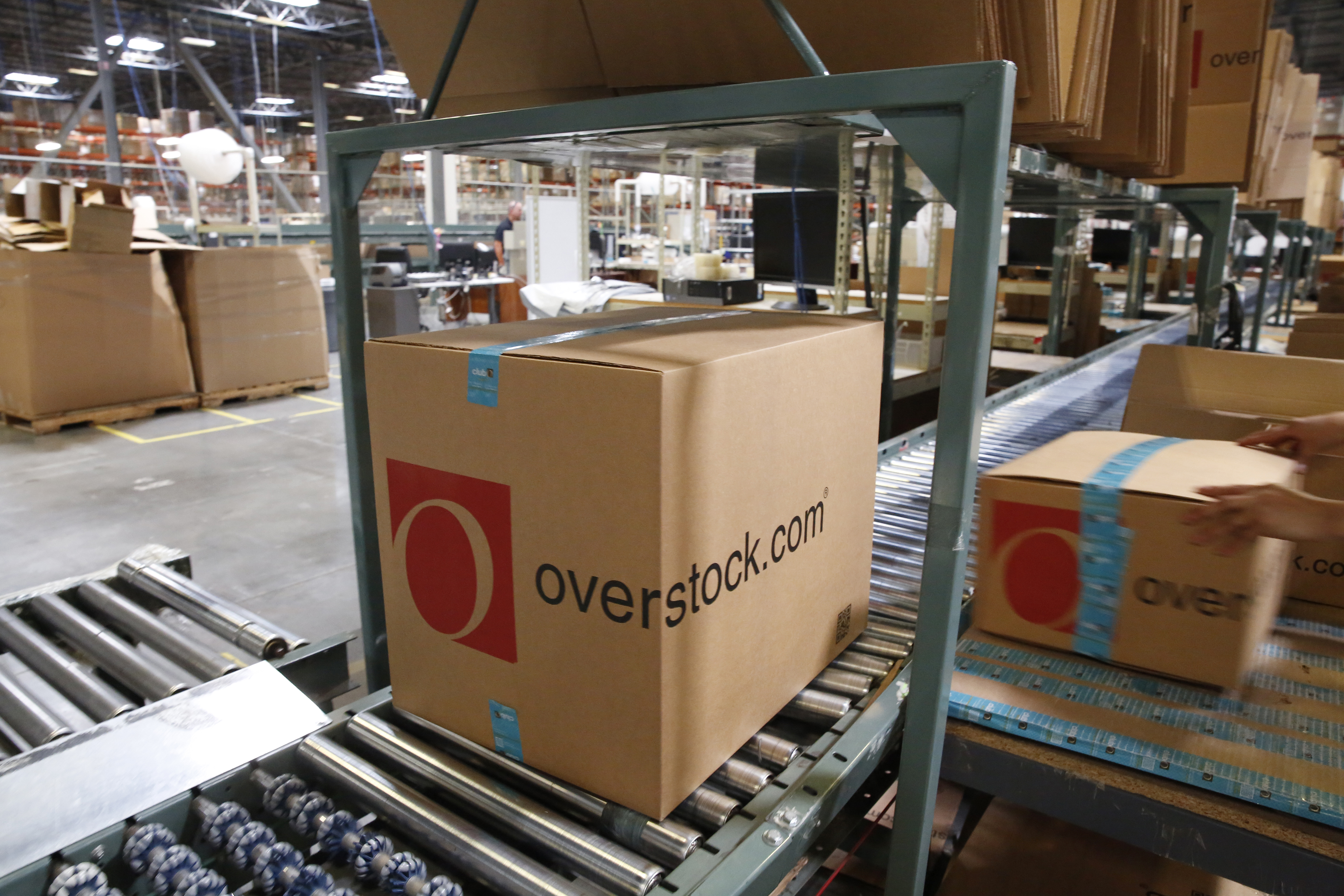 A package moves along a conveyor belt at the Overstock.com Inc. fulfillment center in Salt Lake City, Utah, U.S., on Wednesday, Aug. 8, 2018. The U.S. Census Bureau is scheduled to release wholesalers inventories figures on August 28. Photographer: Daniel Carde/Bloomberg via Getty Images