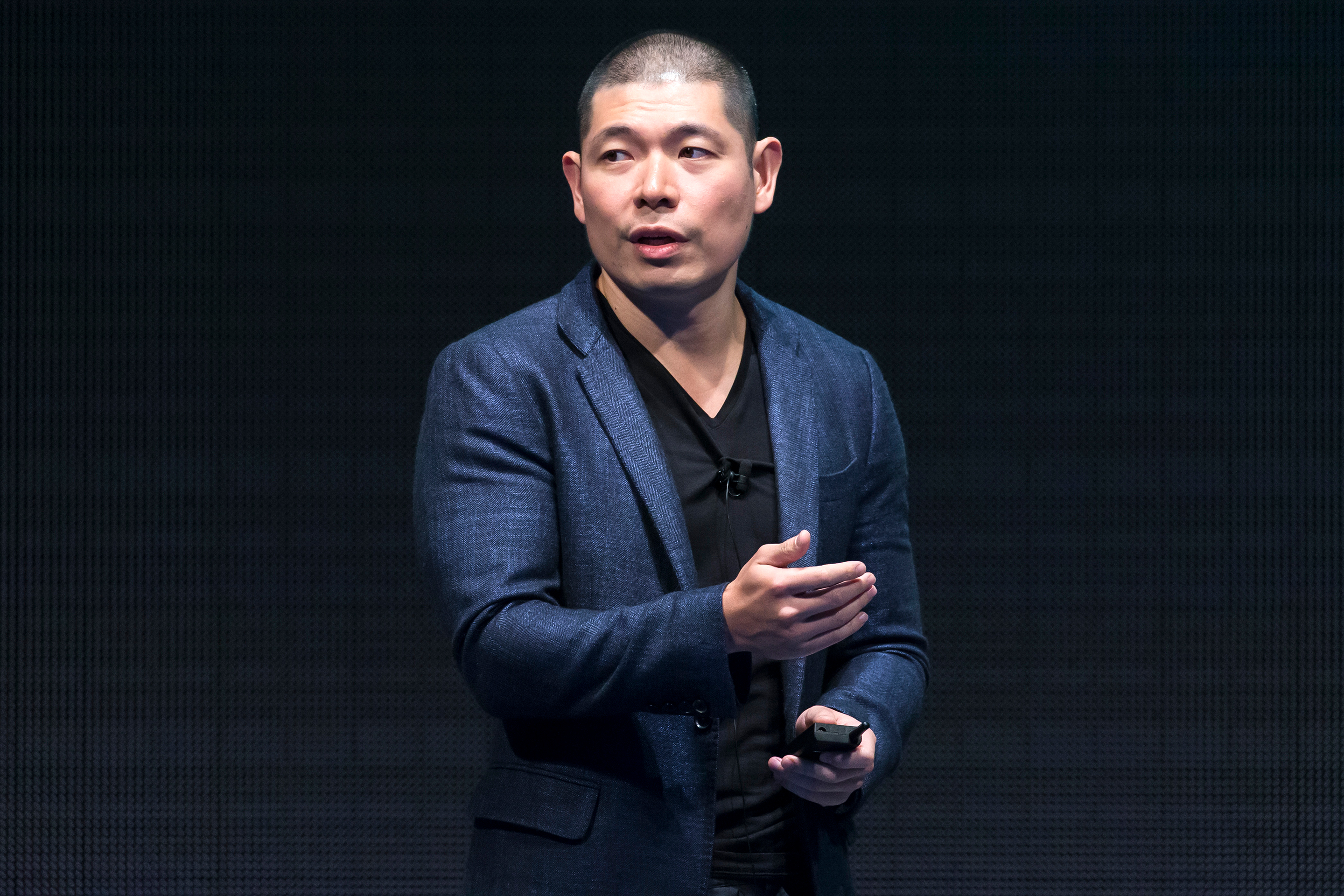 TOKYO, JAPAN - JULY 18:  Grab Holdings Inc. Co-founder and Chief Executive Officer Anthony Tan makes a speech during the SoftBank World 2019 conference on July 18, 2019 in Tokyo, Japan. The annual business event hosted by SoftBank, Japan's multinational telecommunications and internet company, takes place for 2 days until July 19.  (Photo by Tomohiro Ohsumi/Getty Images)
