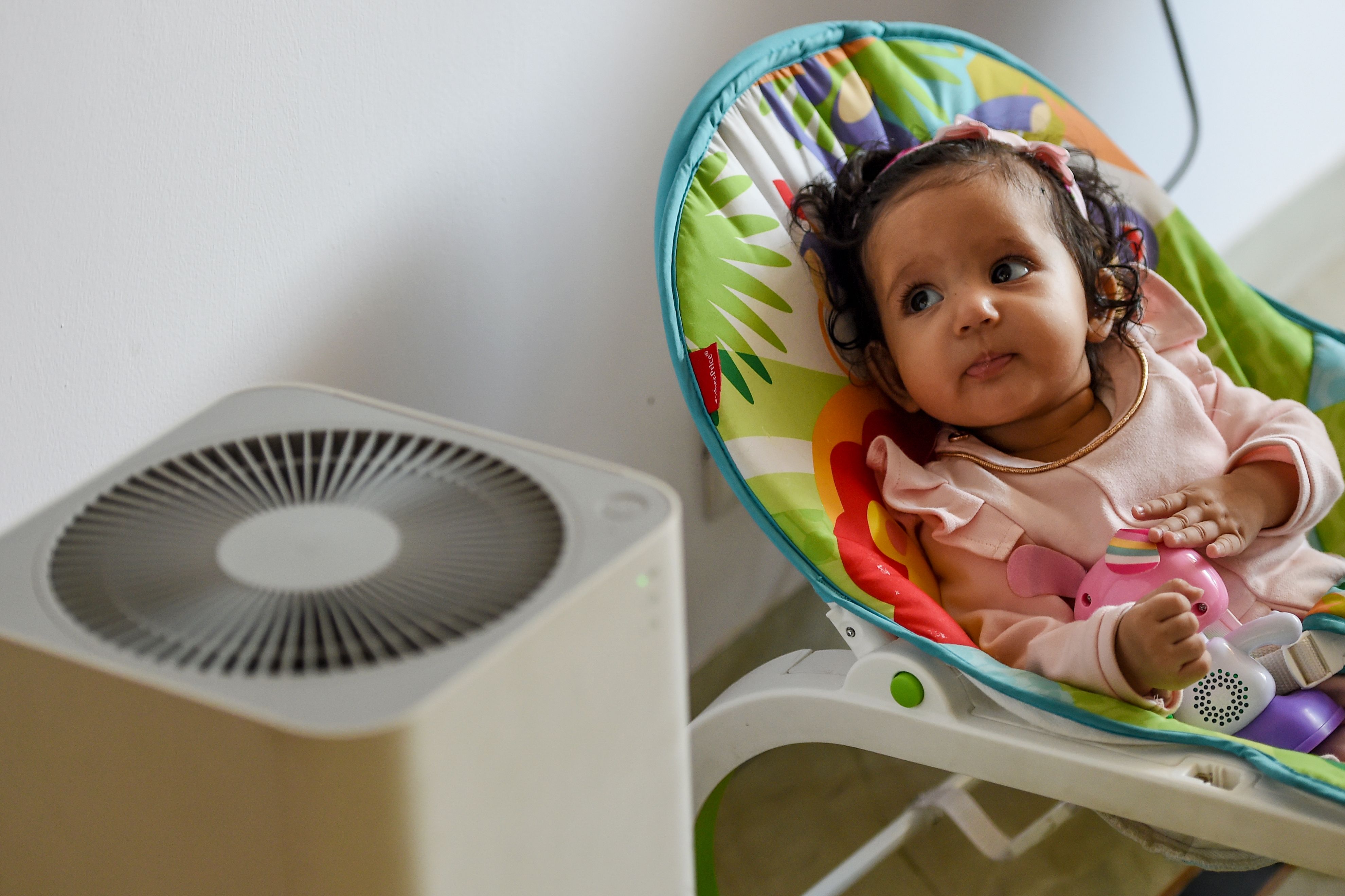 Baby with air purifier