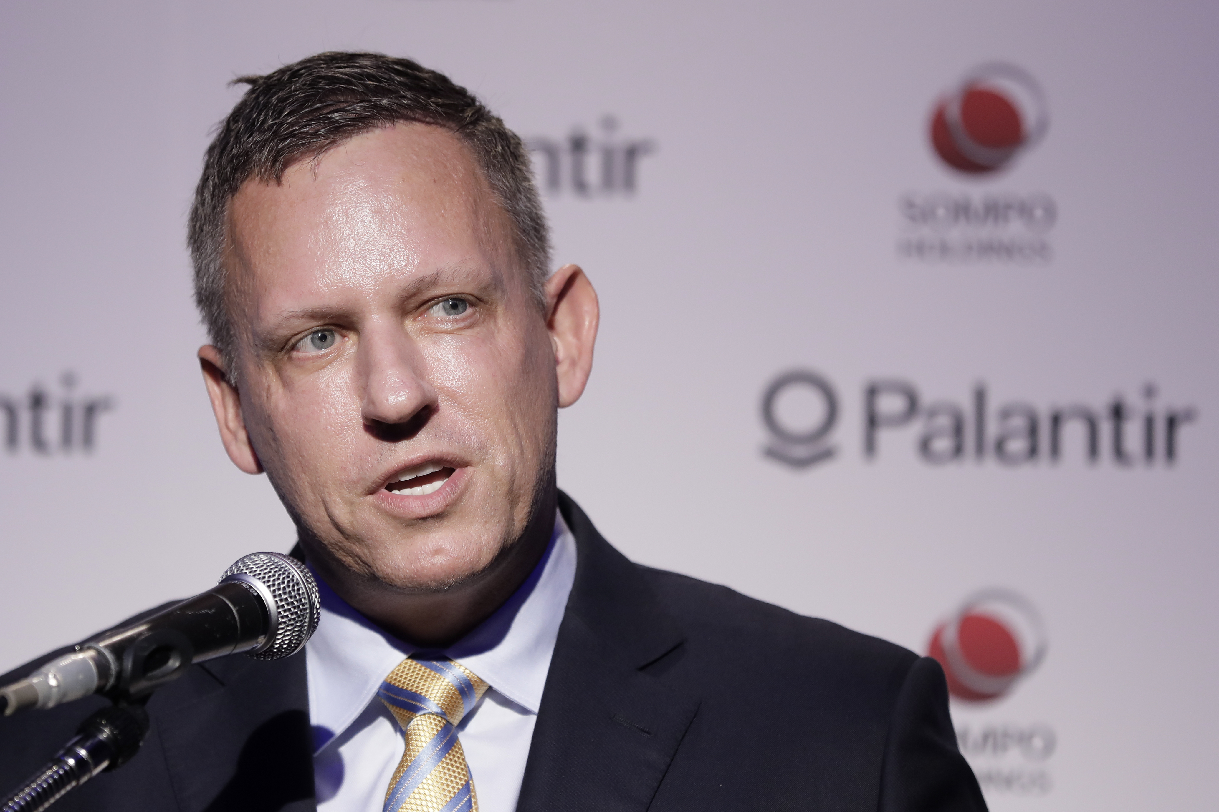 Peter Thiel, co-founder and chairman of Palantir Technologies Inc., speaks during a news conference in Tokyo, Japan, on Monday, Nov. 18, 2019. The billionaire entrepreneur was in Japan to unveil a $150 million, 50-50 joint venture with local financial services firm Sompo Holdings Inc. Palantir Technologies Japan Co. will target government and public sector customers, emphasizing health and cybersecurity initially. 