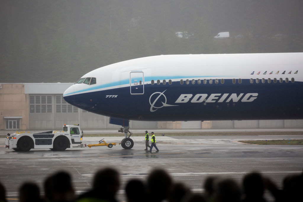 A Boeing 777X airplane returns from its inaugural flight at Boeing Field in Seattle, Washington on January 25, 2020.