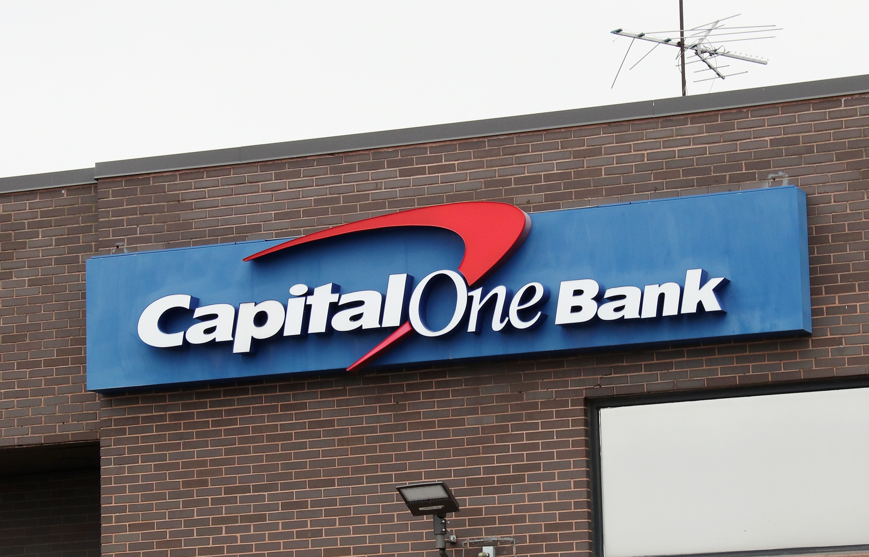 WESTBURY, NEW YORK - MARCH 20: A general view of a Capital One Bank sign as photographed on March 20, 2020 in Westbury, New York.