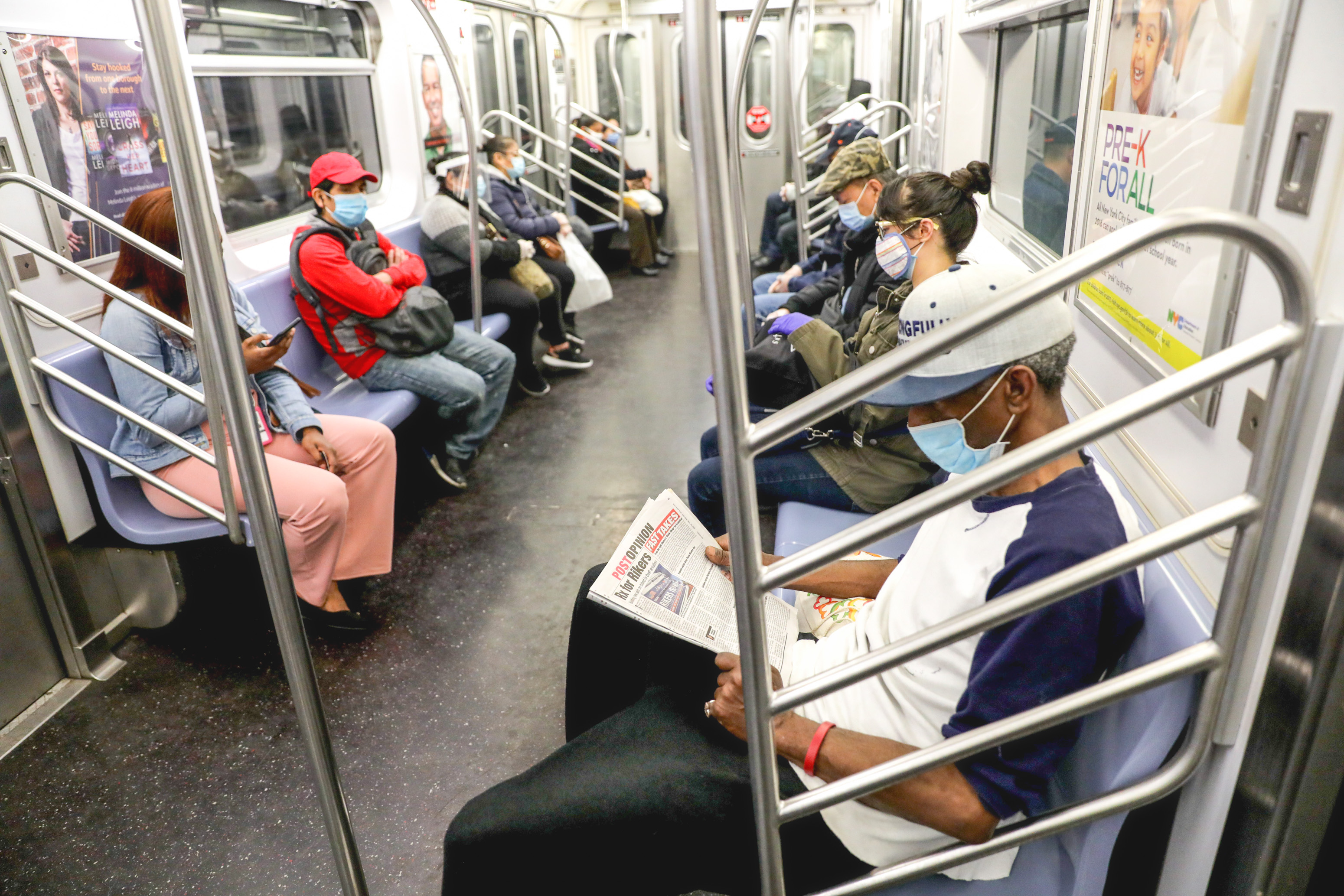 NEW YORK, NY - MAY 18: Passengers wear face masks and observe social distancing on the New York City Subway on May 18, 2020 in New York City. Jose Perez—Bauer-Griffin/GC Images