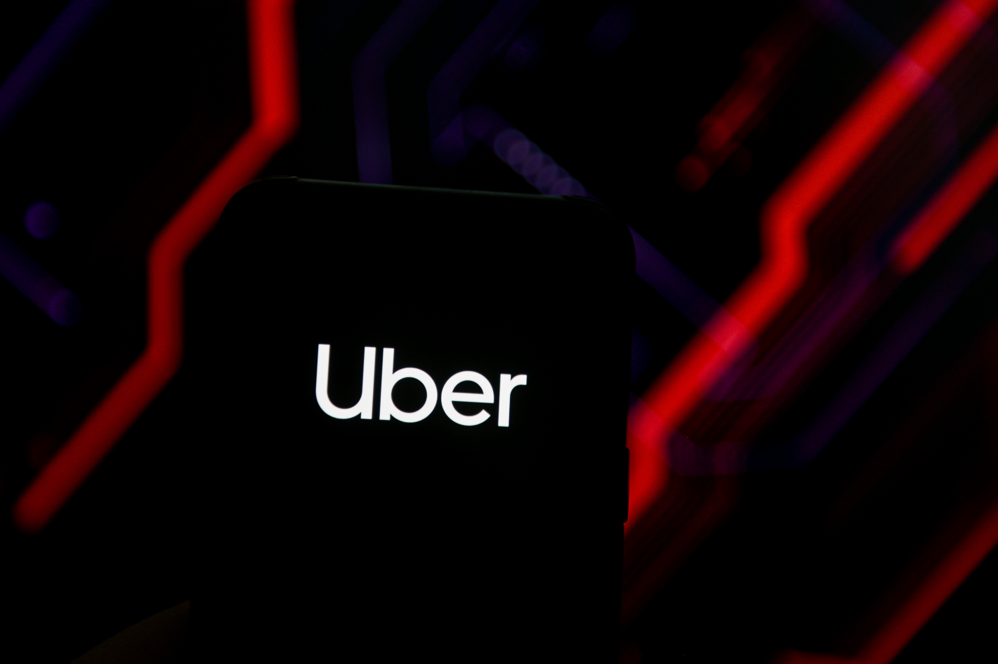 POLAND - 2020/06/15: In this photo illustration an Uber logo seen displayed on a smartphone.