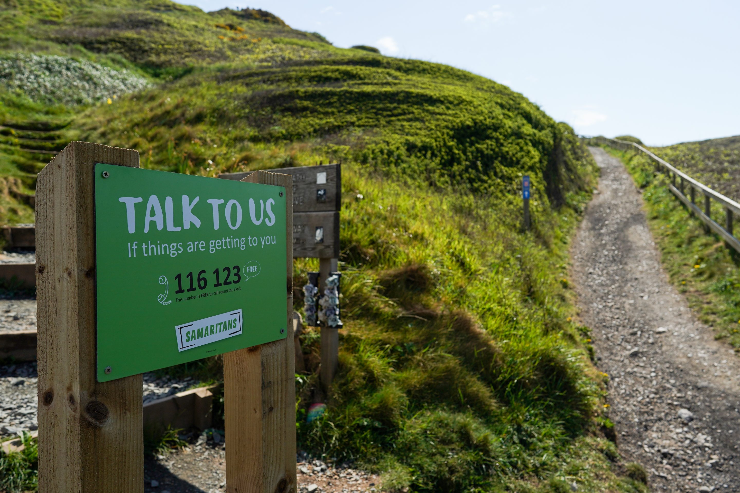 SALTBURN BY THE SEA, UNITED KINGDOM - MAY 01: A sign from the Samaritans offering reassurance is placed at the foot of a path that follows steep sea cliffs on the outskirts of Saltburn to support those who might be contemplating suicide on May 01, 2020 in Saltburn By The Sea, United Kingdom. Increased social isolation, loneliness, health anxiety, economic pressures and stress are leading to increased concern for mental health issues during the Coronavirus pandemic. British Prime Minister Boris Johnson, who returned to Downing Street this week after recovering from Covid-19, said the country needed to continue its lockdown measures to avoid a second spike in infections. (Photo by Ian Forsyth/Getty Images)
