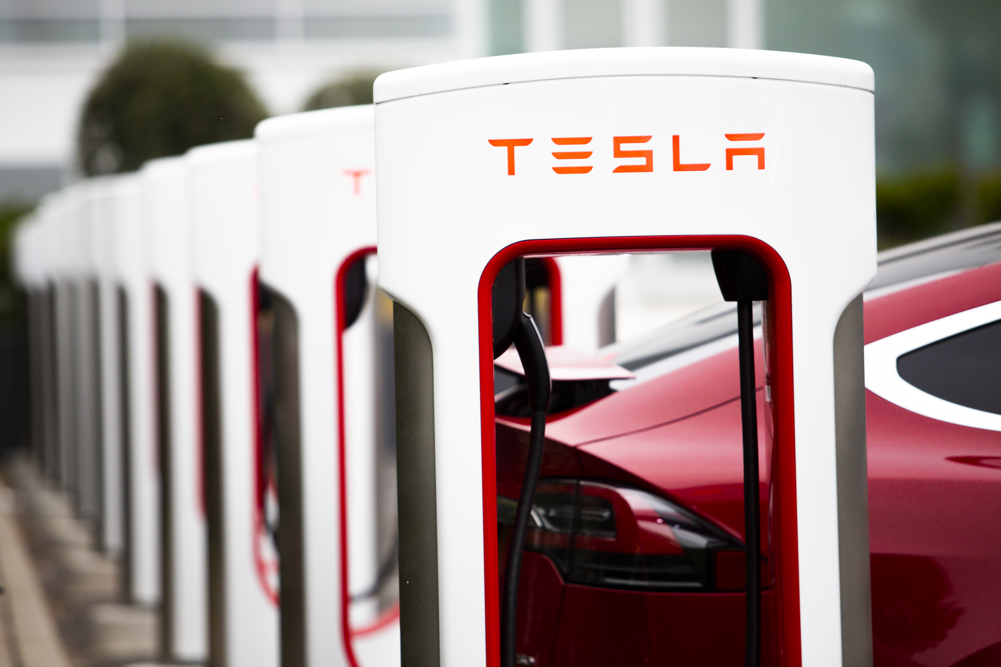 Tesla Inc. electric vehicles charge at the Tesla Supercharger station in Fremont, California, U.S., on Monday, July 20, 2020. Tesla Inc. is scheduled to release earnings figures on July 22. Photographer: Nina Riggio/Bloomberg via Getty Images