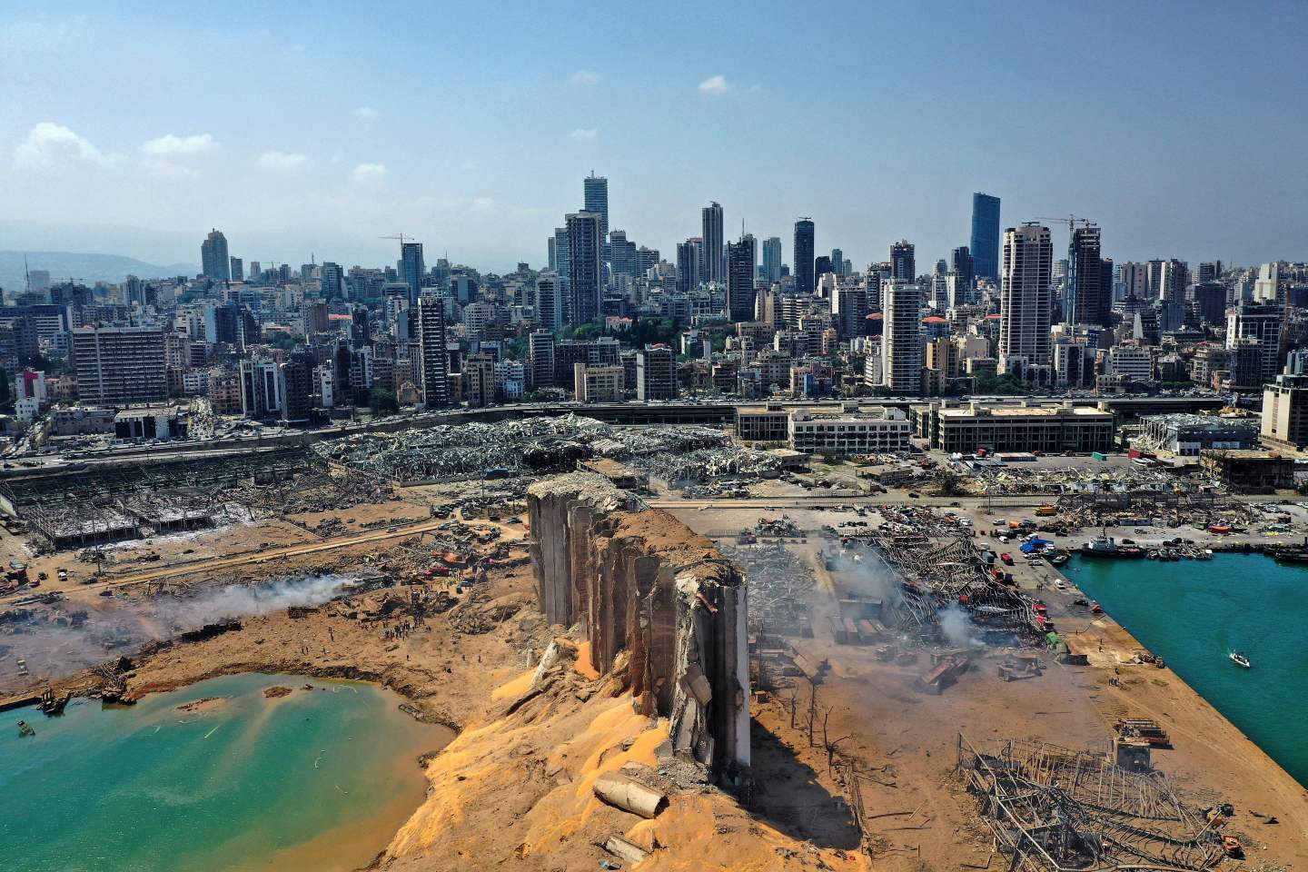 An aerial view shows the massive damage done to Beirut port's grain silos and the area around it on August 5, 2020, one day after a mega-blast tore through the harbour in the heart of the Lebanese capital with the force of an earthquake, killing more than 100 people and injuring over 4,000.