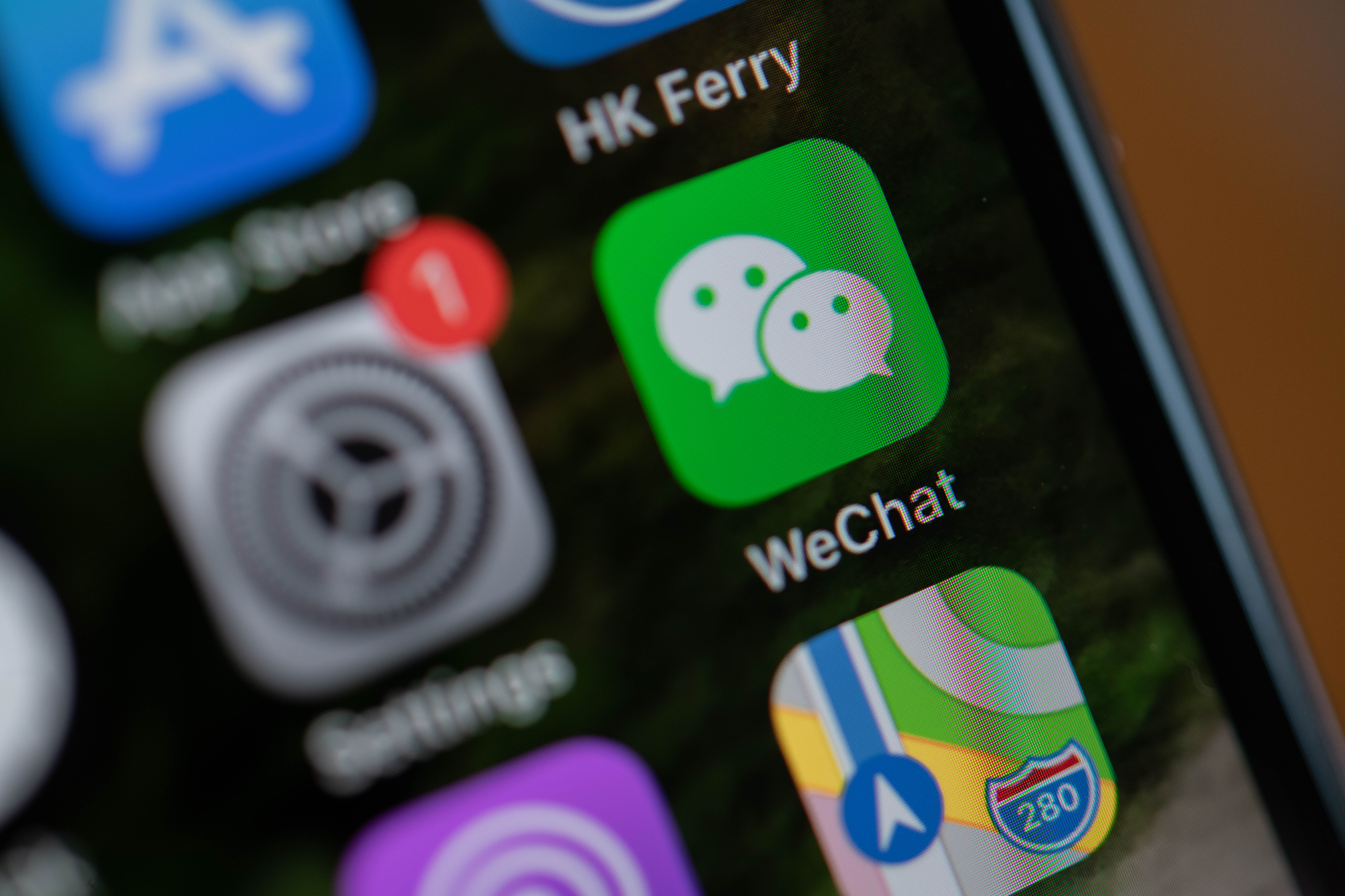 Tencent Holdings Ltd.'s WeChat app icon is arranged for a photograph on a smartphone in Hong Kong, China, on Friday, Aug. 7, 2020. President Donald Trump signed a pair of executive orders prohibiting U.S. residents from doing business with the Chinese-owned TikTok and WeChat apps beginning 45 days from now, citing the national security risk of leaving Americans' personal data exposed. Photographer: Ivan Abreu/Bloomberg via Getty Images