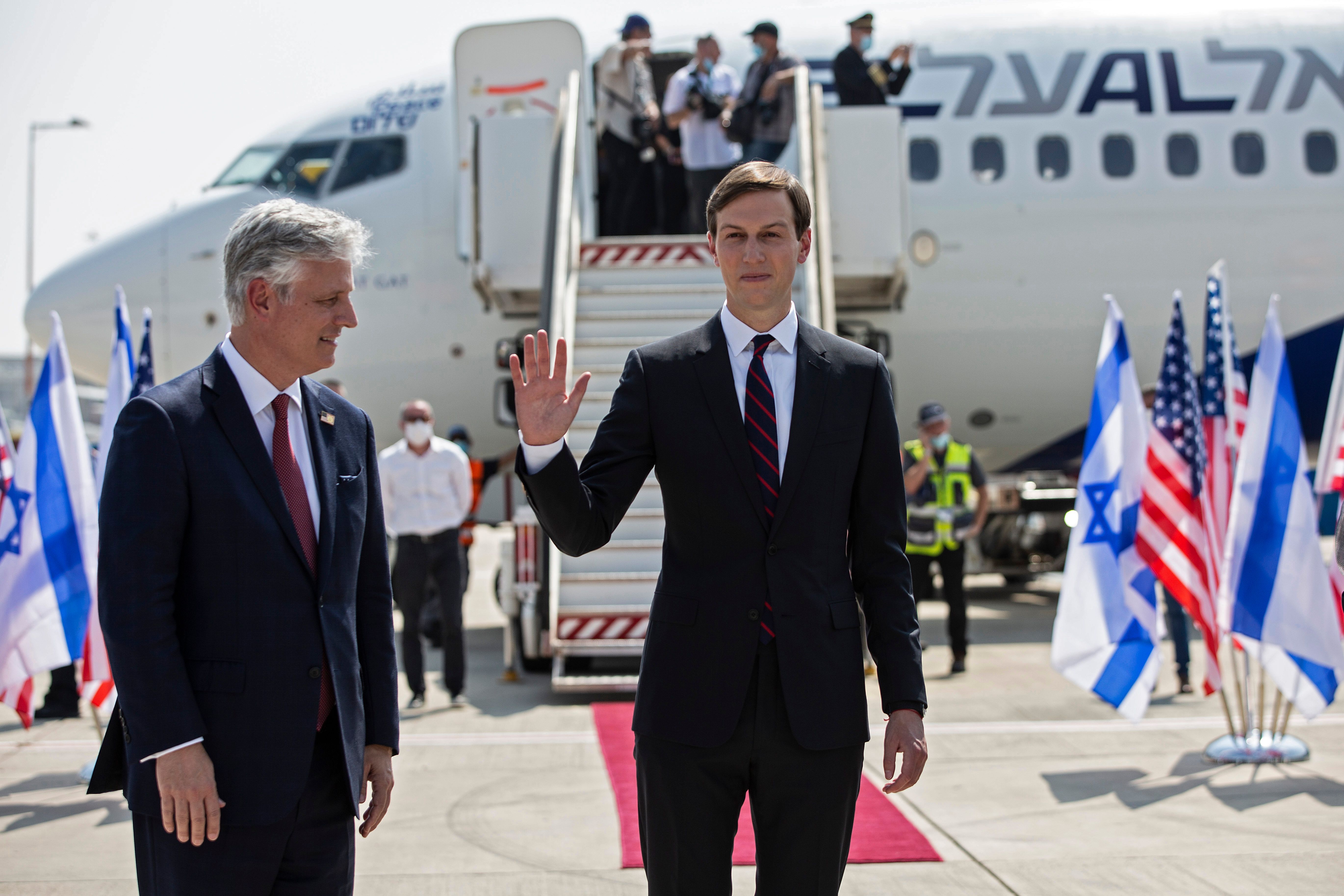 US Presidential Adviser Jared Kushner (R) waves as he stands next to US National Security Adviser Robert OBrien ahead of boarding the El Al's flight LY971, which will carry an Israeli-American delegation from Tel Aviv to Abu Dhabi, at the Ben Gurion Airport near Tel Aviv on August 31, 2020. - The El Al flight, scheduled to leave at 0730 GMT from Ben Gurion Airport near Tel Aviv, will carry a delegation led on the American side by President Donald Trump's son-in-law and White House advisor Jared Kushner. (Photo by Heidi levine / AFP) (Photo by HEIDI LEVINE/AFP via Getty Images)