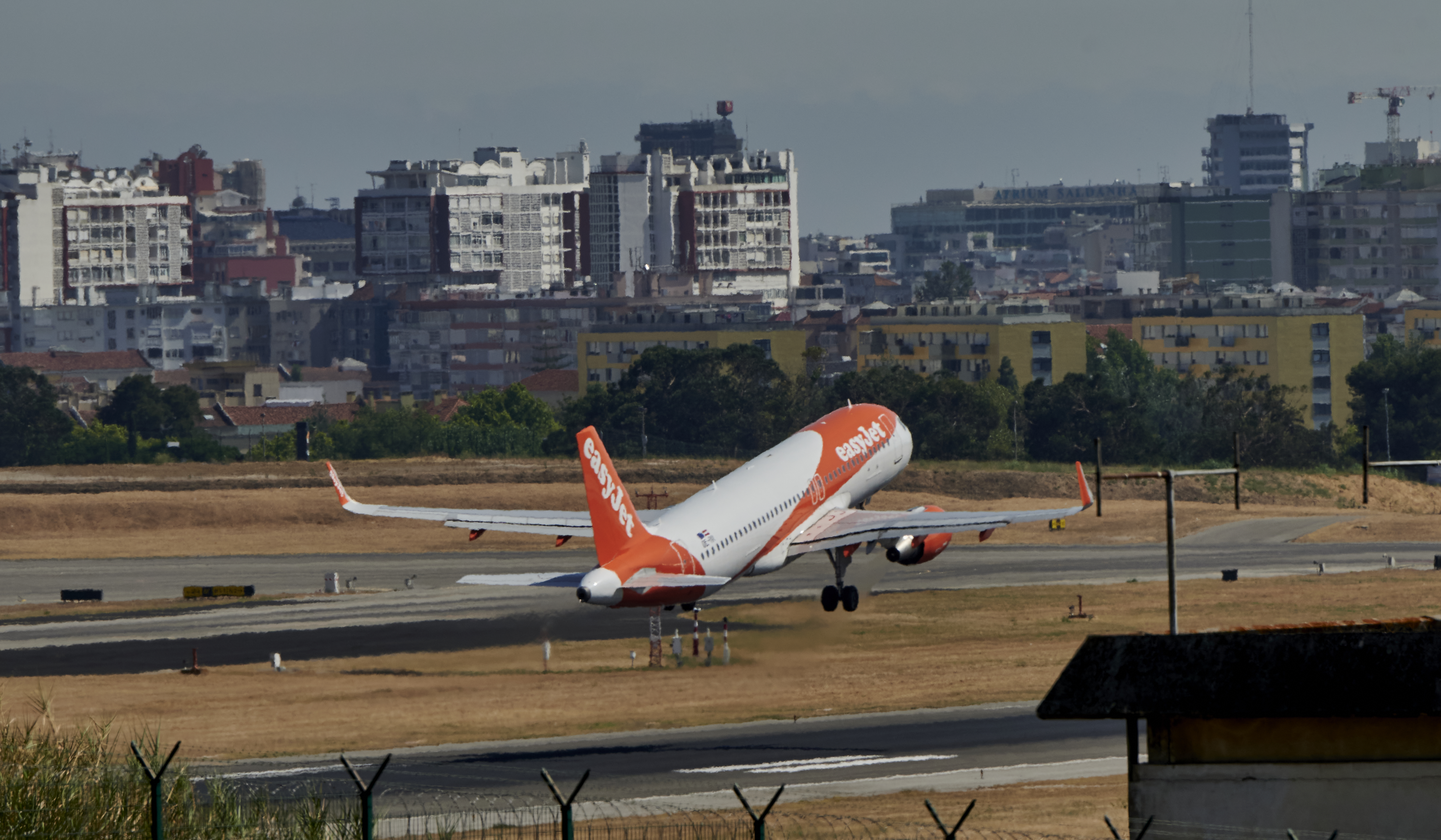 EasyJet Airbus A320-214(WL) takes off in Humberto Delgado International Airport on a hot afternoon during the COVID-19 Coronavirus pandemic, on July 22, 2020 in Lisbon, Portugal.