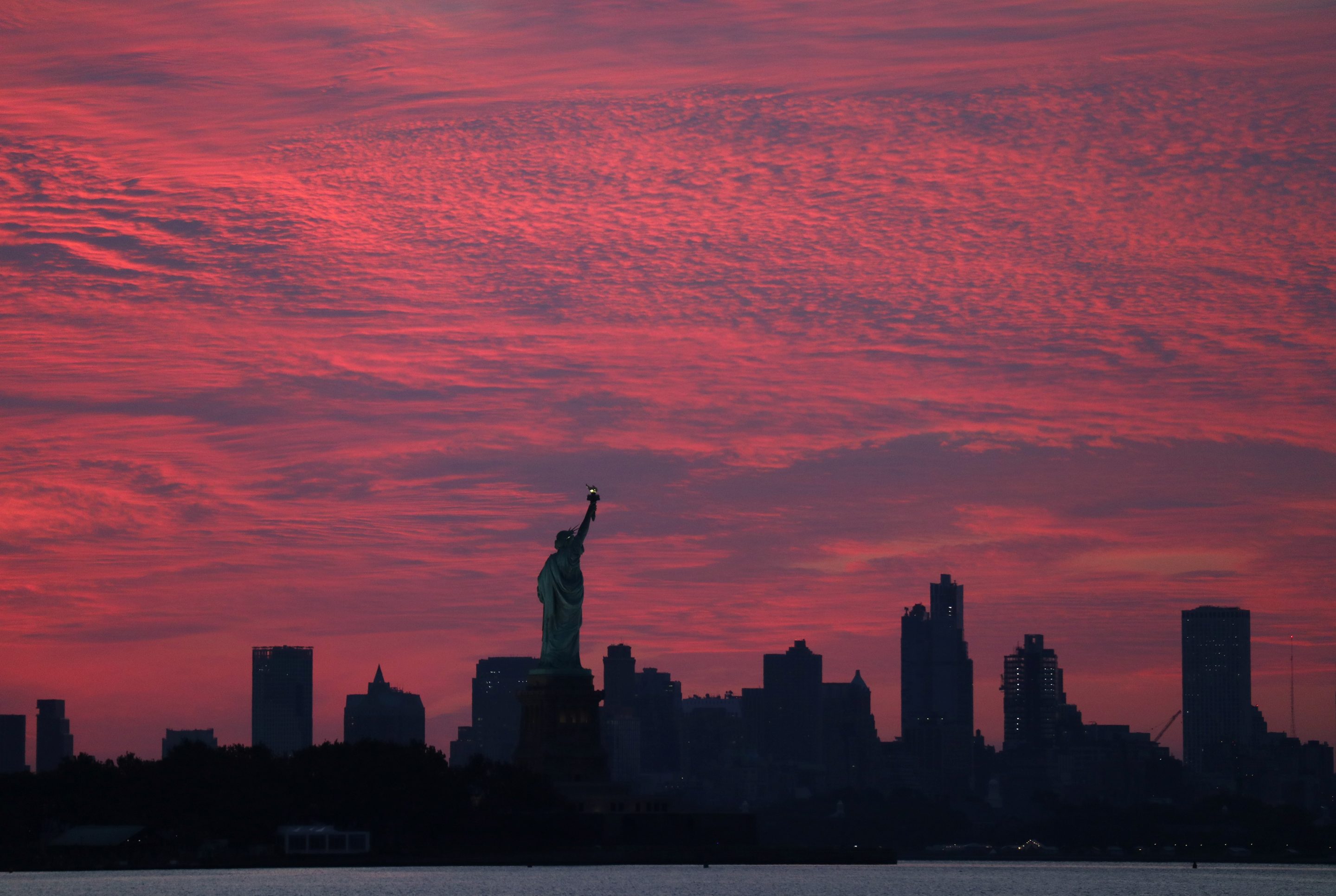 statue of liberty at the sunrise in new york city