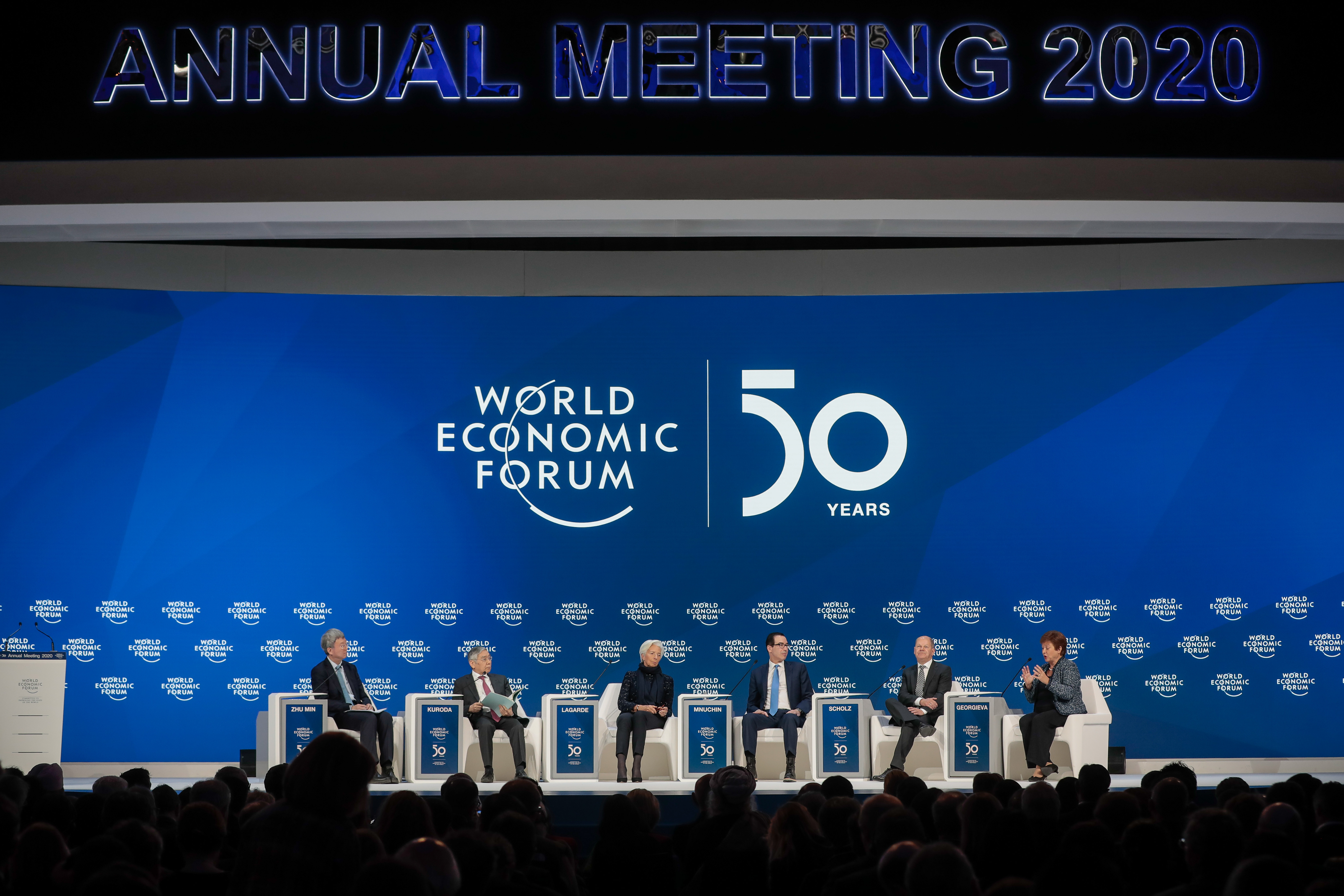 From left to right, Zhu Min, deputy managing director of the International Monetary Fund (IMF), Haruhiko Kuroda, governor of the Bank of Japan (BOJ), Christine Lagarde, president of the European Central Bank (ECB), Steven Mnuchin, U.S. Treasury secretary, Olaf Scholz, Germany's finance minister, and Kristalina Georgieva, managing director of the International Monetary Fund (IMF), attend a panel session on the closing day of the World Economic Forum (WEF) in Davos, Switzerland, on Friday, Jan. 24, 2020. World leaders, influential executives, bankers and policy makers attend the 50th annual meeting of the World Economic Forum in Davos from Jan. 21 - 24. Photographer: Jason Alden/Bloomberg via Getty Images
