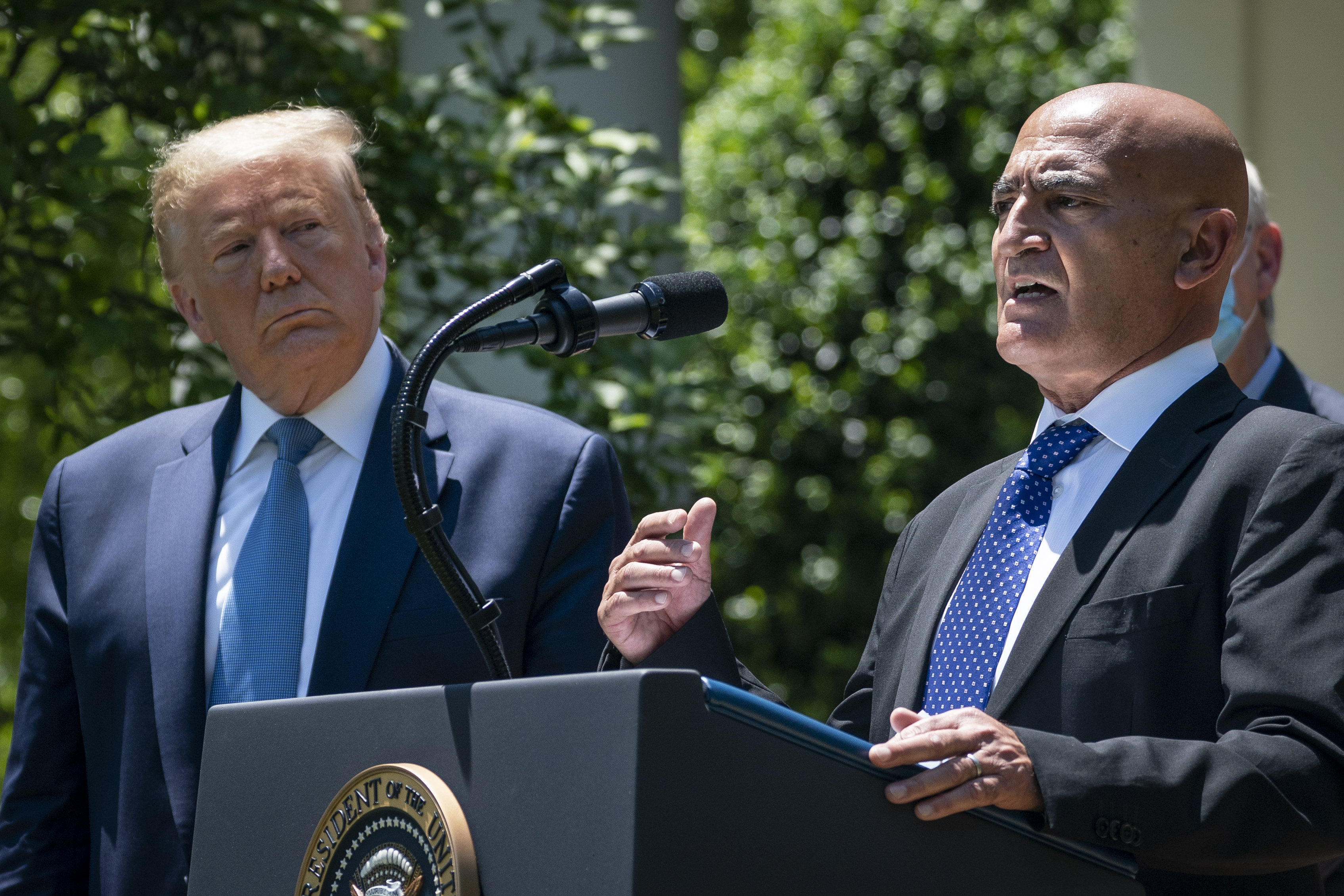 President Trump and Moncef Slaoui, the lead scientist on the "Operation Warp Speed" COVID-19 vaccine effort, at a White House press conference earlier this year. (Photo by Drew Angerer/Getty Images)