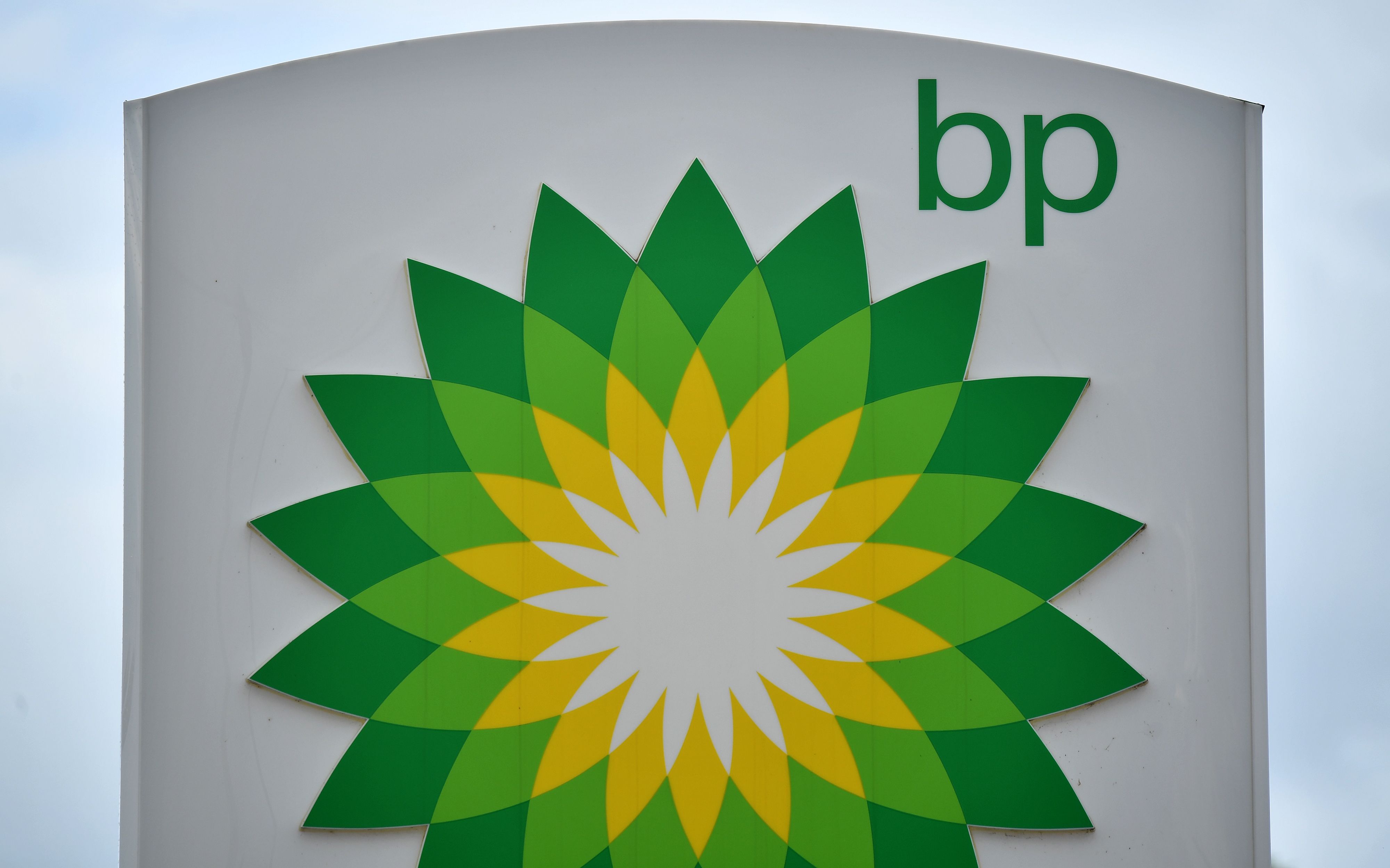 BP logos are seen at a BP petrol and diesel filling station in Hildenborough, southeast of London on June 15, 2020, following the announcement that the oil giant will take a hit of up to $17.5 billion (11.4 billion euros and 15.3 billion euros), due to the ongoing COVID-19 global pandemic. - British energy giant BP said Monday that it will take a hit of up to $17.5 billion in the second quarter as "sustained" coronavirus fallout ravages global oil demand. The company, fresh from outlining plans to axe almost 10,000 jobs on COVID-19 fallout, said in a statement that it will suffer a negative impact of between $13 billion and $17.5 billion (11.4 billion euros and 15.3 billion euros) in non-cash impairments and write-offs. (Photo by Ben STANSALL / AFP) (Photo by BEN STANSALL/AFP via Getty Images)