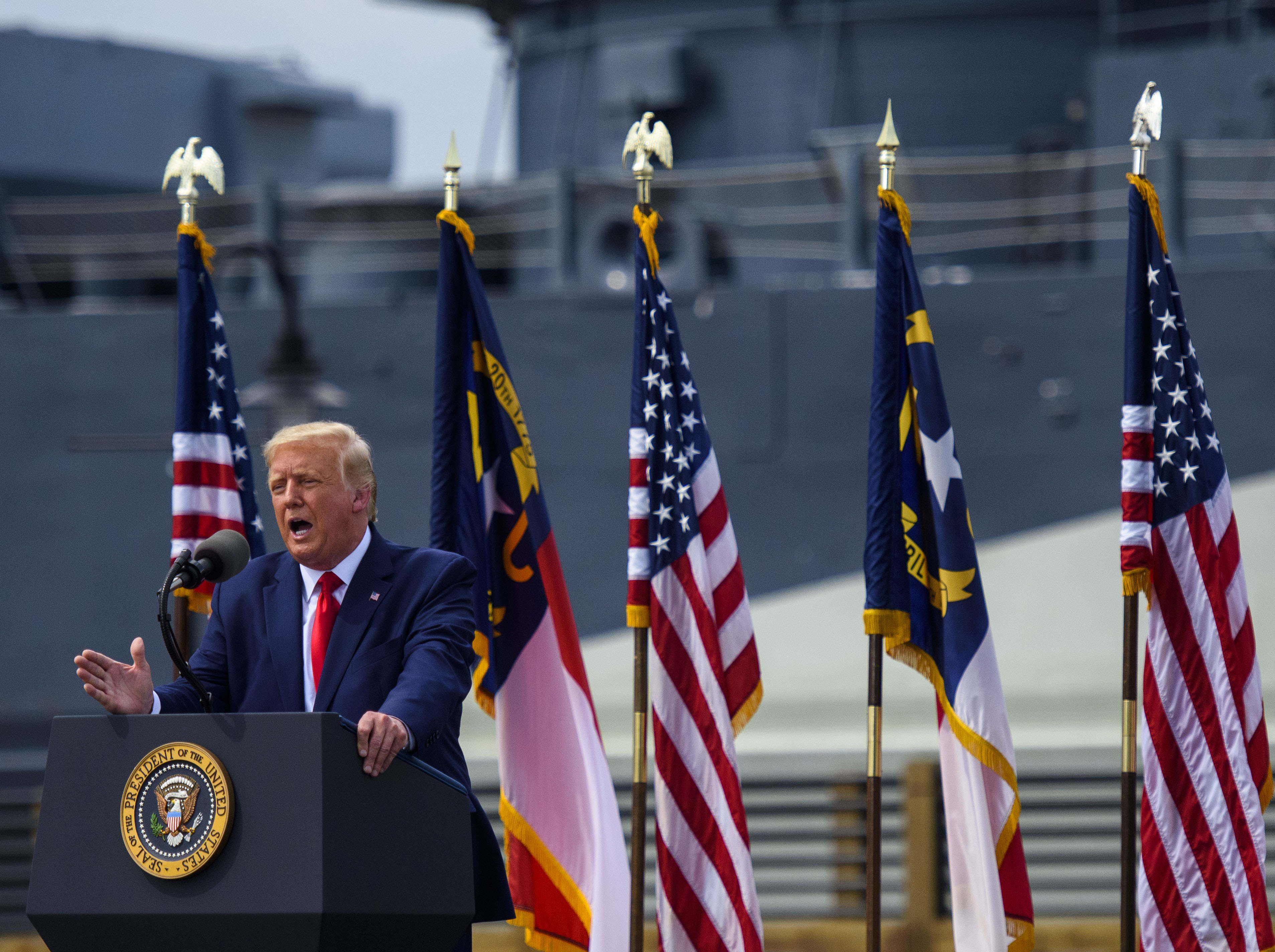 WILMINGTON, NC - SEPTEMBER 02: President Donald Trump speaks to a small crowd outside the USS North Carolina on September 2, 2020 in Wilmington, North Carolina. President Donald Trump visited the port city for a brief ceremony designating Wilmington as the nation's first WWII Heritage City. The title is in honor of the area's efforts during WWII.