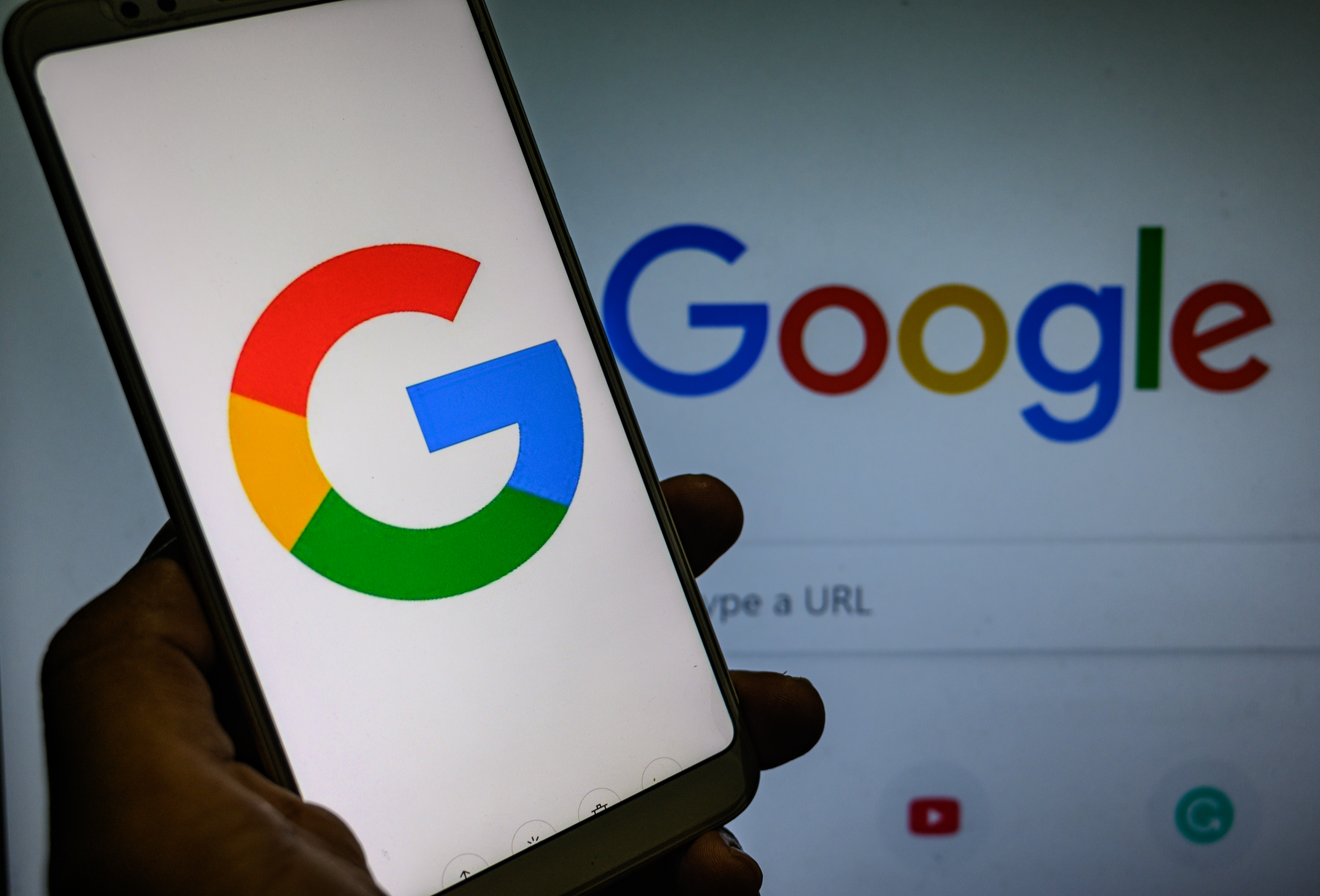In this photo illustration, screens display the logos of Google in Tehatta, Nadia, West Bengal, India on September 4, 2020. Google is bringing the 'Kormo Jobs' Android app to India to help job seekers find and apply for positions across India.