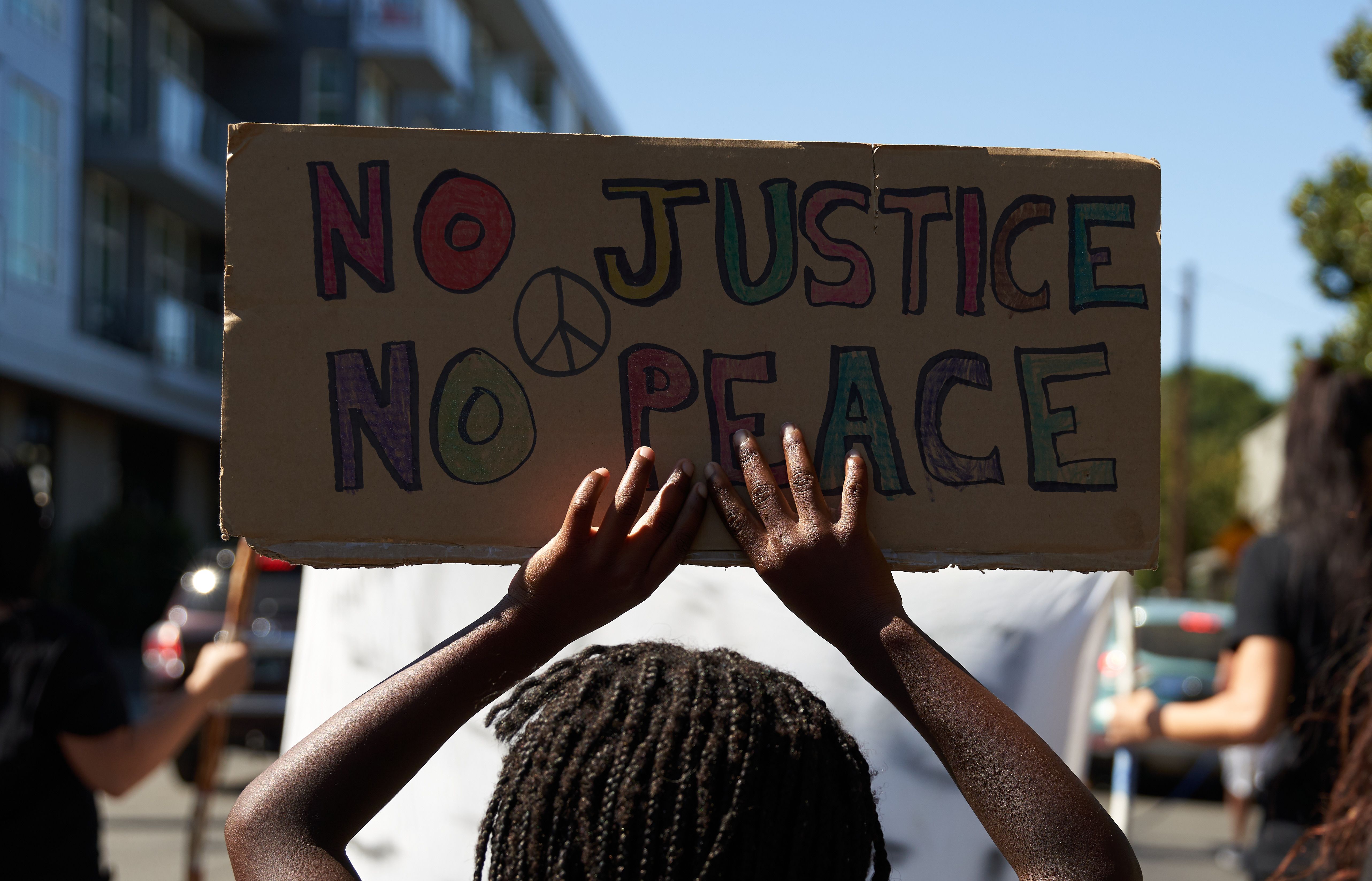 TOPSHOT - Families march for Black Lives asking for justice and police reform in Portland, Oregon on September 6, 2020. - Aaron Danielson, 39, a supporter of a far-right group called Patriot Prayer, was fatally shot August 29, 2020, in Portland, Oregon after he joined pro-Trump supporters who descended on the western US city, sparking confrontations with Black Lives Matter counter-protesters. (Photo by Allison Dinner / AFP) (Photo by ALLISON DINNER/AFP via Getty Images)