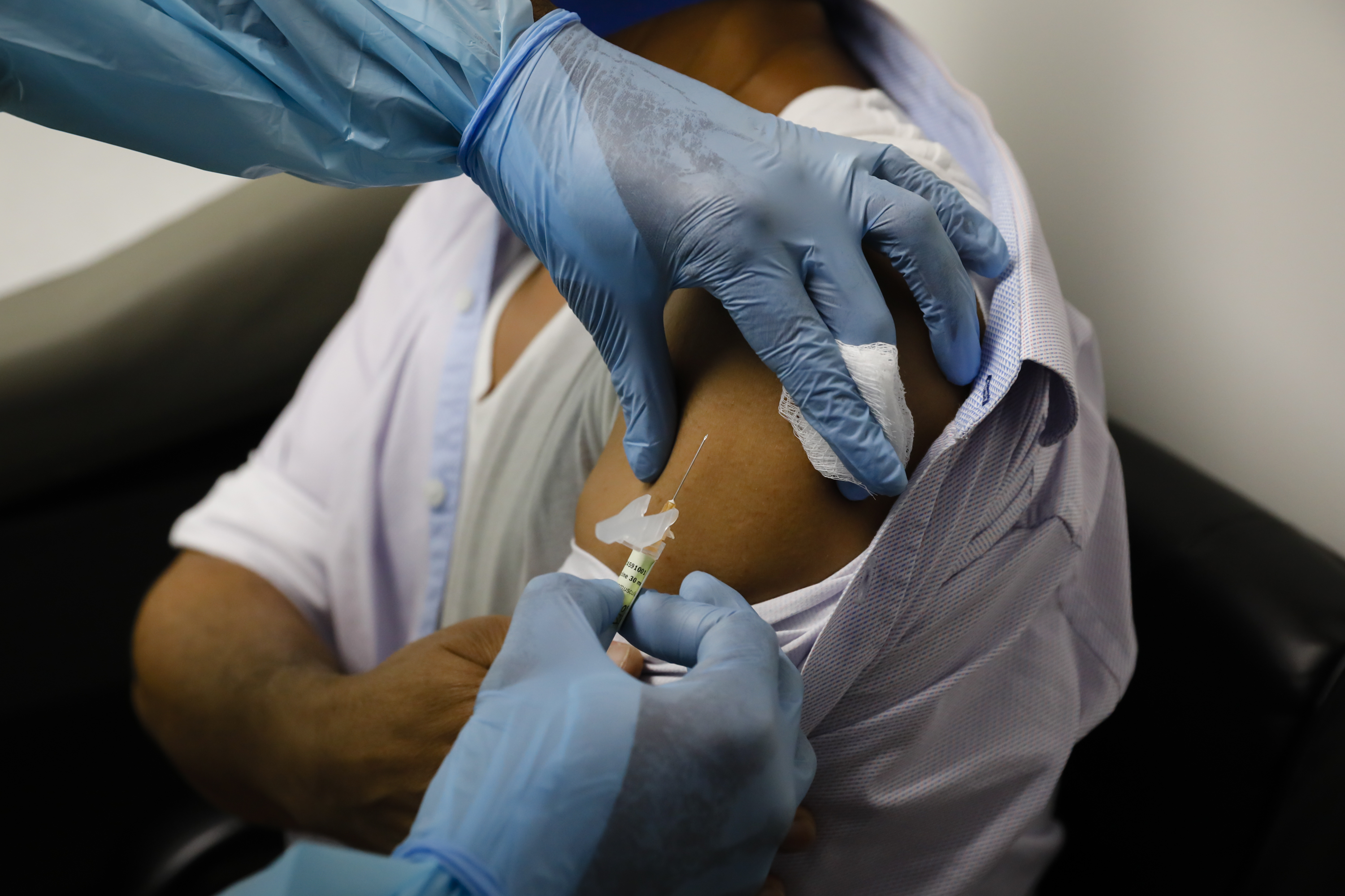 A health worker injects a volunteer during clinical trials for a COVID-19 vaccine in Hollywood, Fla. (Photo: Eva Marie Uzcategui/Bloomberg via Getty Images)