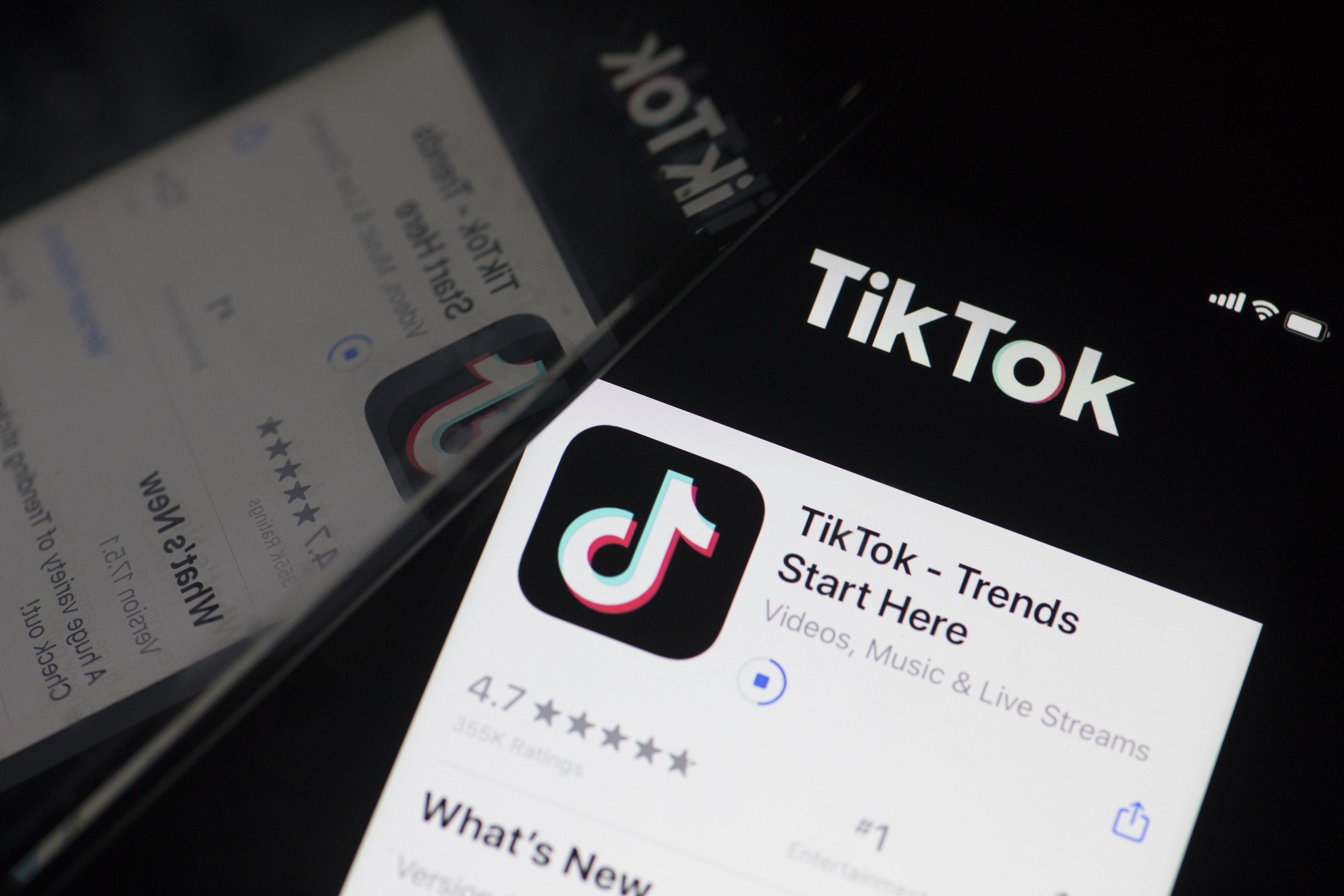 The download page for ByteDance Ltd.'s TikTok app is arranged for a photograph on a smartphone in Sydney, New South Wales, Australia, on Monday, Sept. 14, 2020. Oracle Corp. is the winning bidder for a deal with TikToks U.S. operations, people familiar with the talks said, after main rival Microsoft Corp. announced its offer for the video app was rejected. Photographer: Brent Lewin/Bloomberg via Getty Images