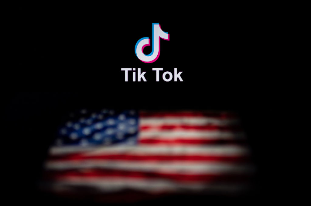 This photo illustration taken on September 14, 2020 shows the logo of the social network application TikTok (top) and a US flag (bottom) shown on the screens of two laptops in Beijing.
Photo by NICOLAS ASFOURI/AFP via Getty Images