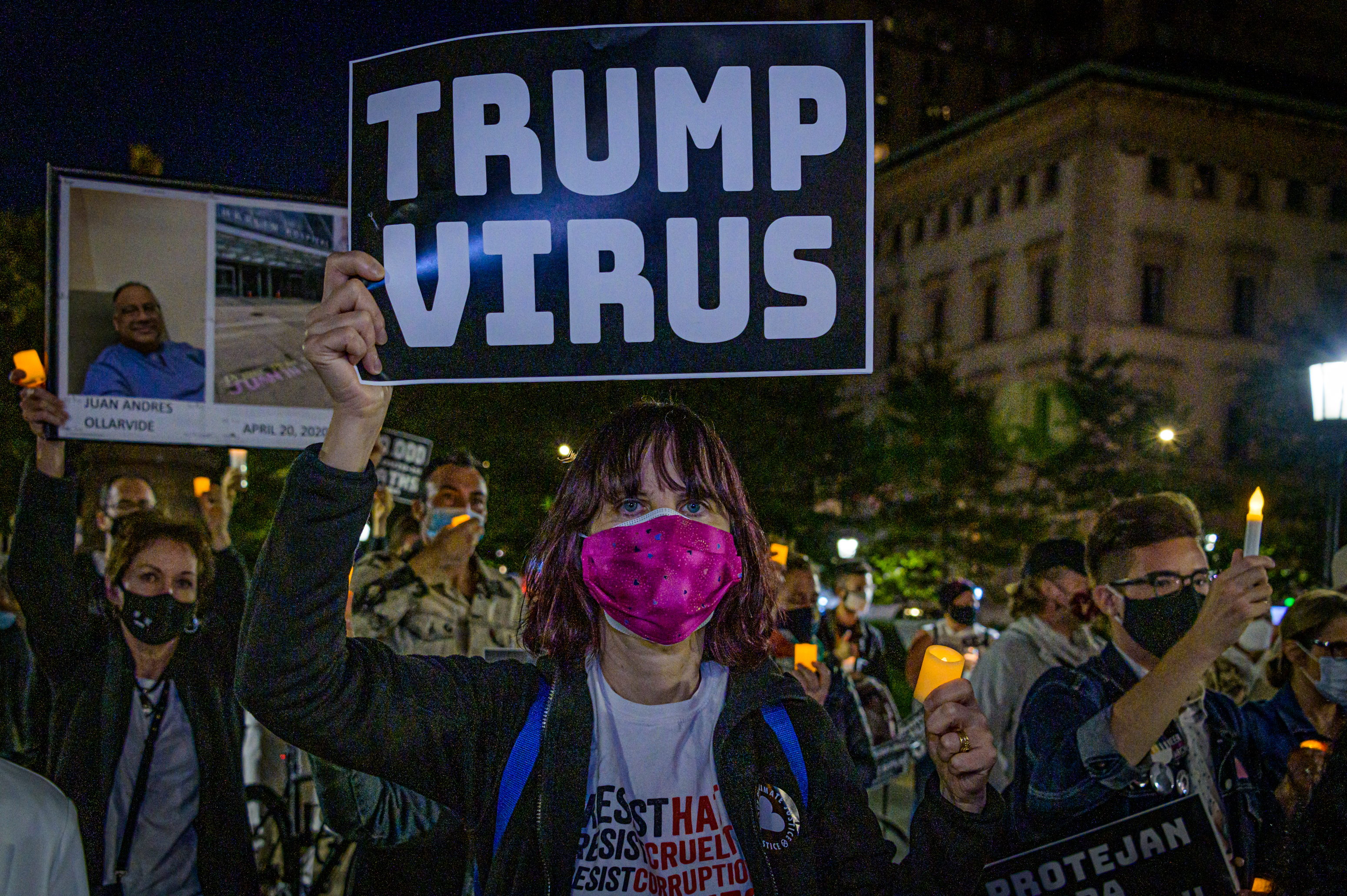 MANHATTAN, NEW YORK, UNITED STATES - 2020/09/20: A participant holding a sign during the vigil. A group of demonstrators gathered in Central Park to mourn the 200,000 COVID lost and call for fundamental, systemic changes to ongoing problems revealed by the current COVID-19 pandemic. (Photo by Erik McGregor/LightRocket via Getty Images)