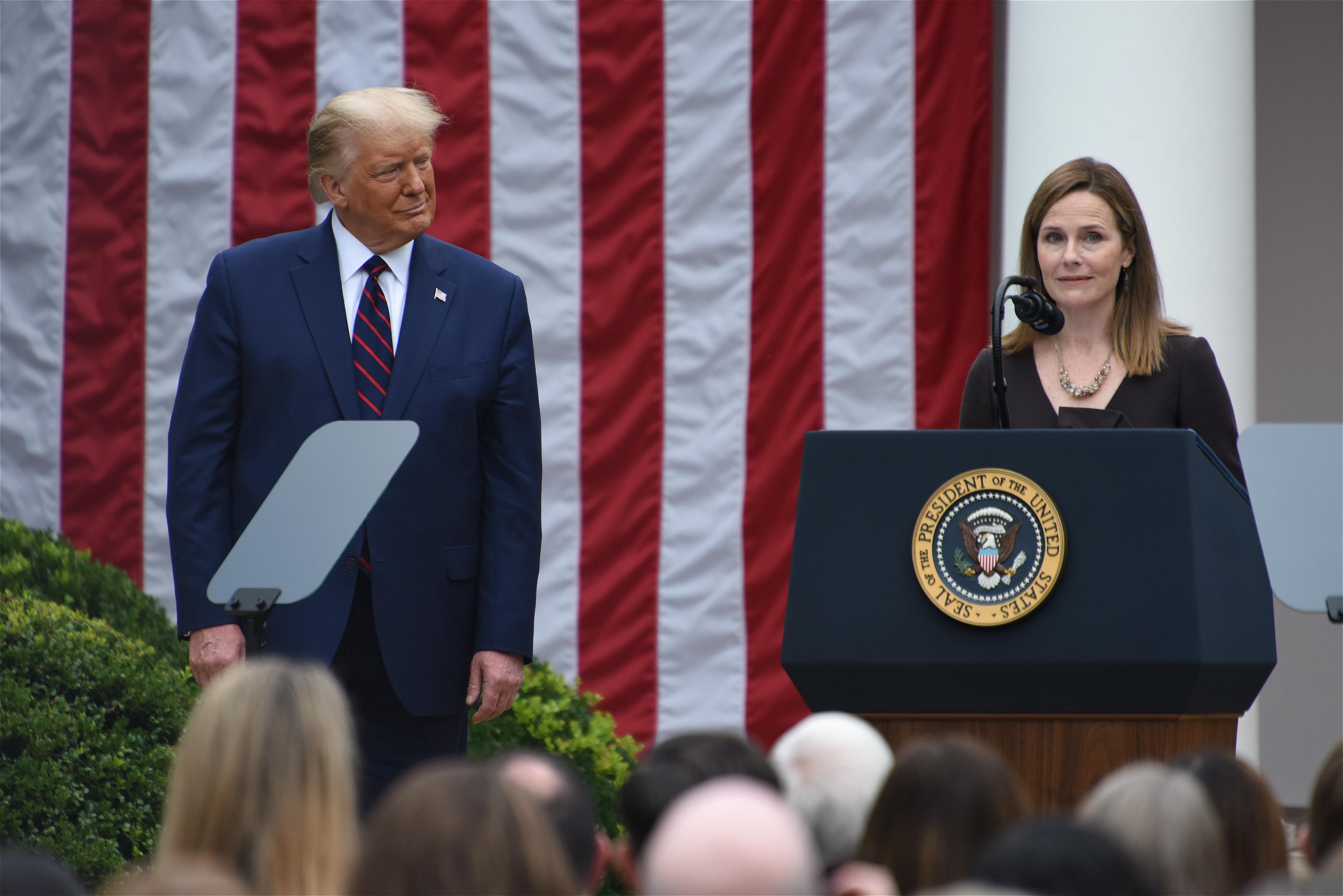Amy Coney Barrett (R), U.S. President Donald Trump's nominee for associate justice of the U.S. Supreme Court, speaks as U.S. President Donald Trump listens during an announcement ceremony at the White House on September 26, 2020 in Washington, D.C. Chen Mengtong/China News Service via Getty Images