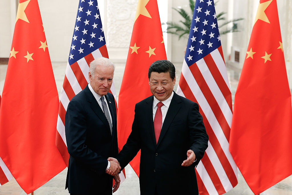 Chinese President Xi Jinping (R) shake hands with then U.S Vice President Joe Biden (L) inside the Great Hall of the People on December 4, 2013 in Beijing, China. Lintao Zhang/Getty Images