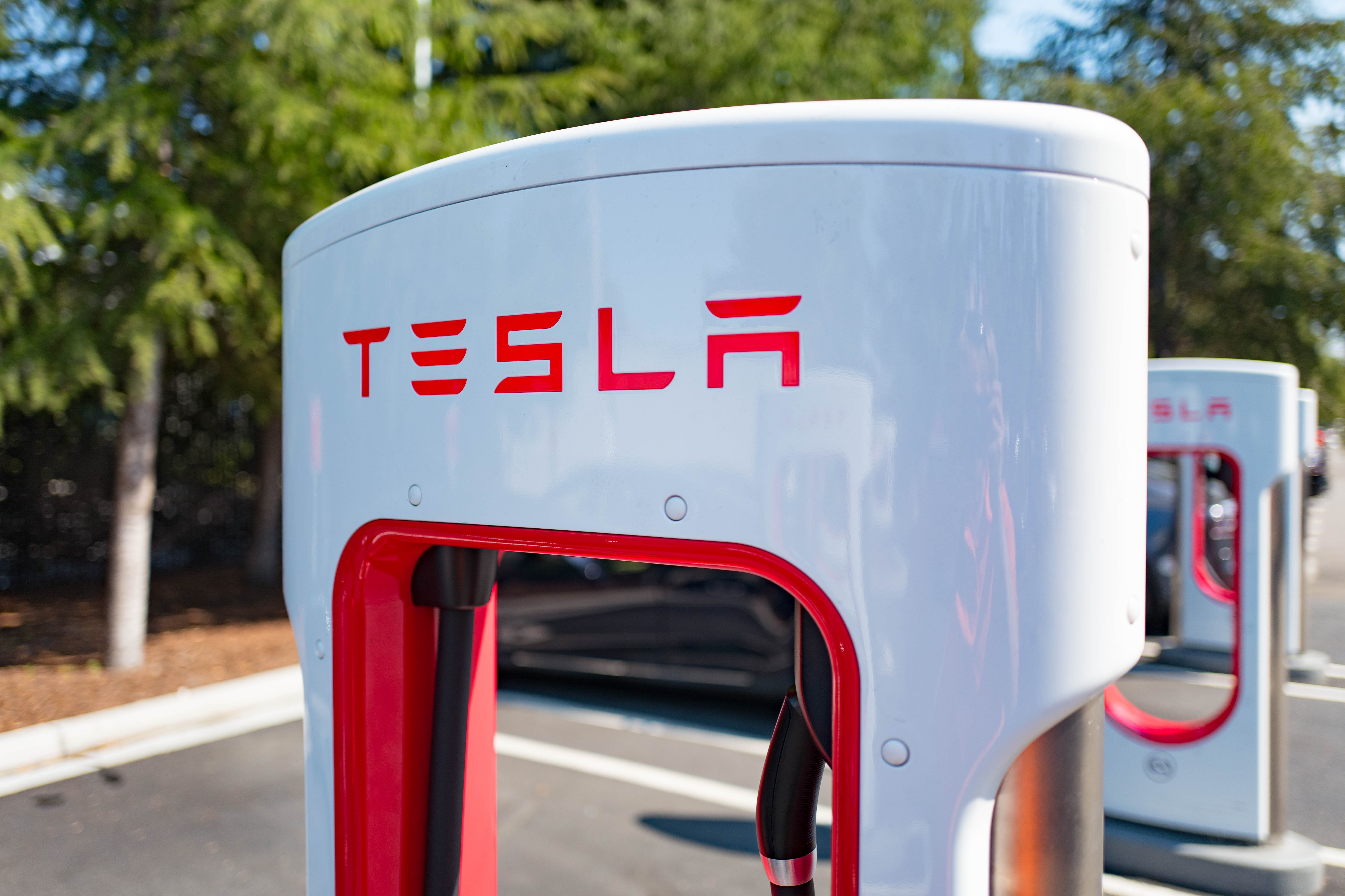 Charger with Tesla logo at a Supercharger rapid battery charging station for the electric vehicle company Tesla Motors, in the Silicon Valley town of Mountain View, California, August 24, 2016.