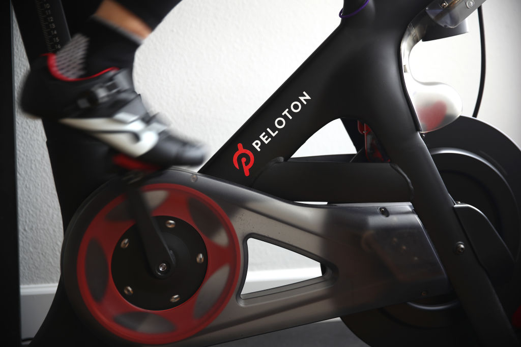 Cari Gundee rides her Peloton exercise bike at her home on April 6, 2020 in San Anselmo, Calif. More people are turning to Peloton due to shelter-in-place orders because of the coronavirus (COVID-19).