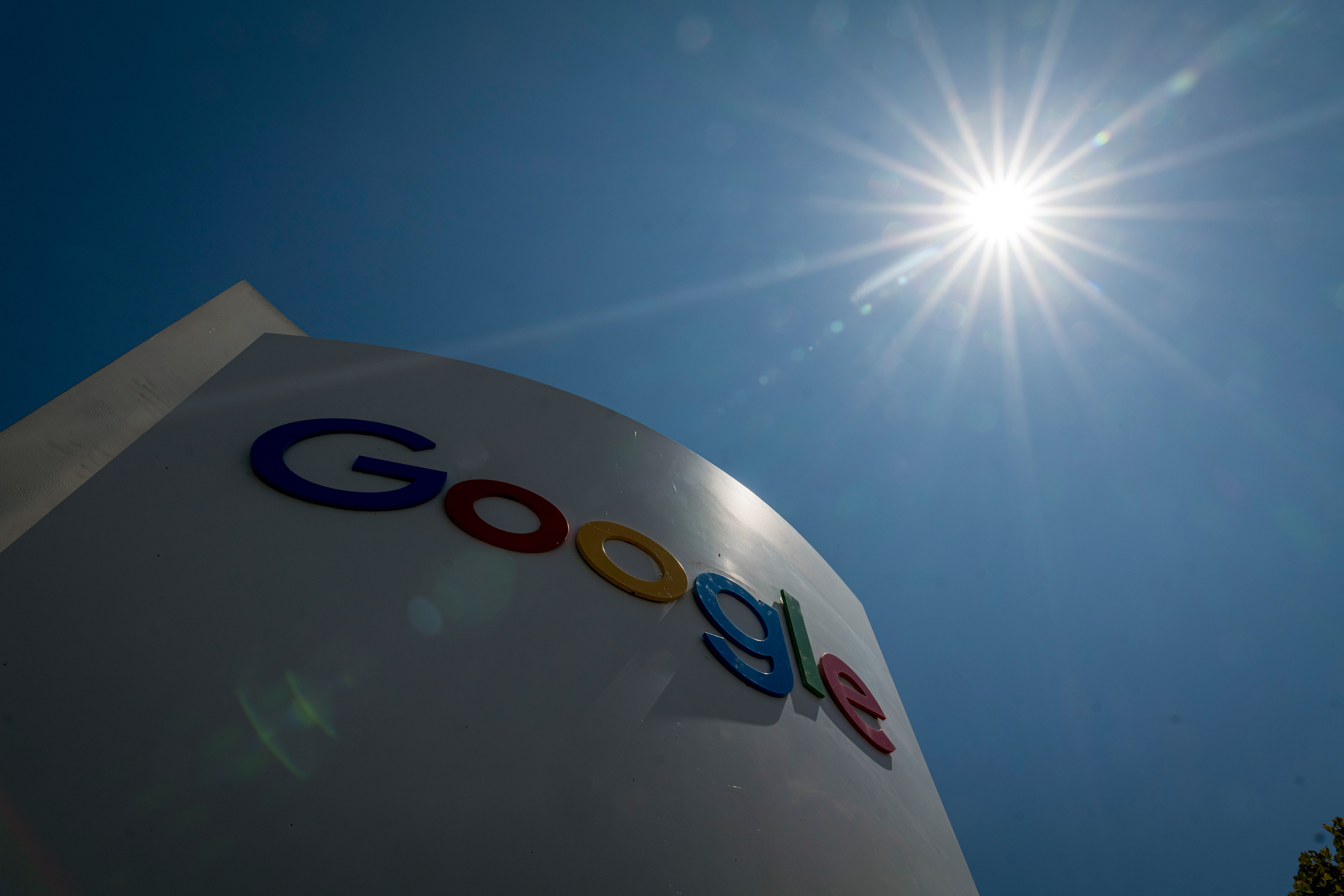 Signage outside the Google campus in Mountain View, California, U.S., on Monday, July 27, 2020. Alphabet Inc.'s Google will let employees work from home until July 2021, once again pushing back the re-opening of its offices as the coronavirus continues to rage in many parts of the U.S. 