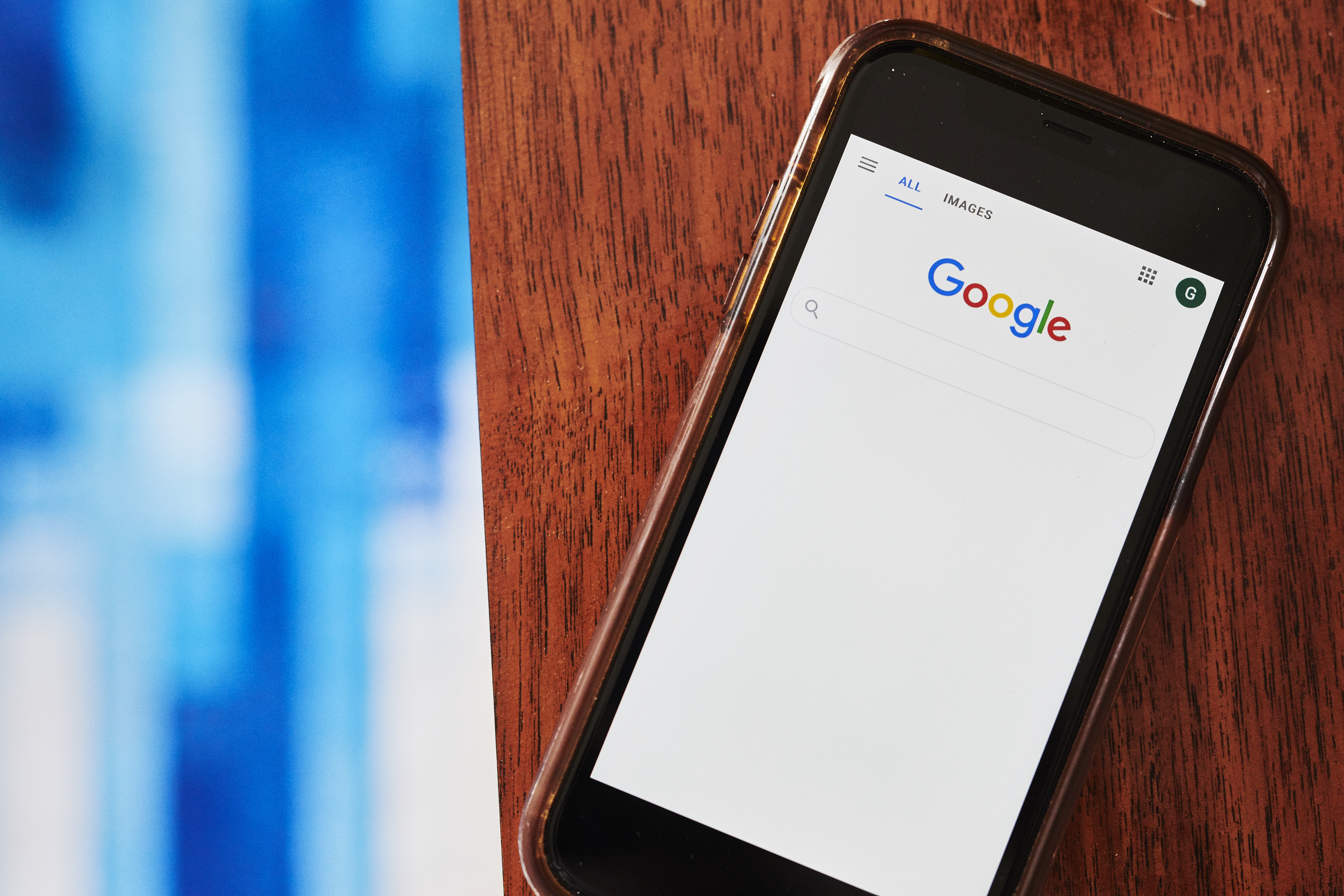 The Google Inc. search page is displayed on a smartphone in an arranged photograph taken in the Brooklyn Borough of New York, U.S., on Friday, July 24, 2020. Alphabet Inc. is scheduled to release earnings figures on July 30.