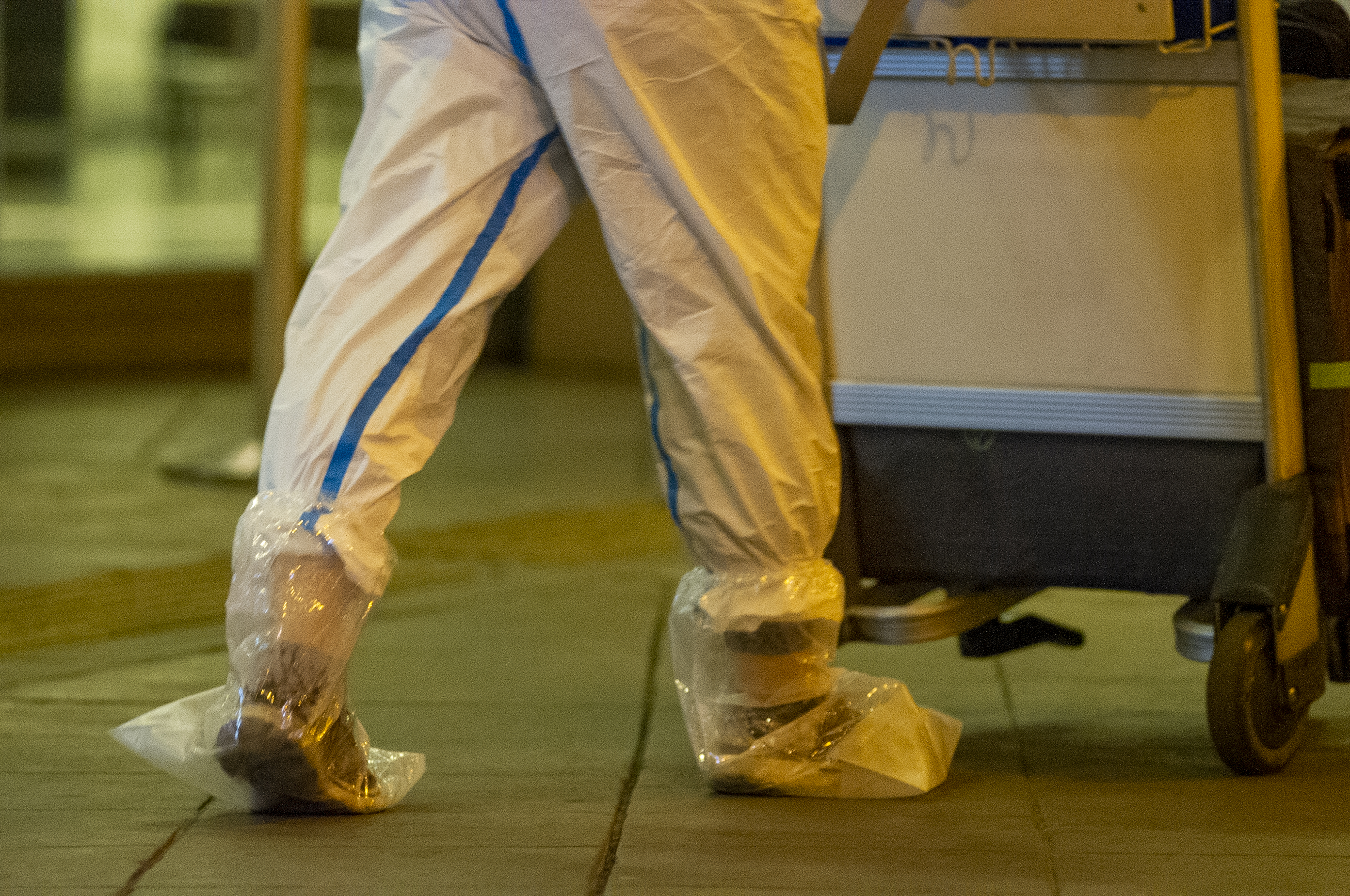 Chinese engineers arrive using protective biohazard suits to prevent the spread of novel Coronavirus on an expedited flight to El Dorado international airport to start the planning of Bogota's metro train system on August 3 2020 in Bogota, Colombia.