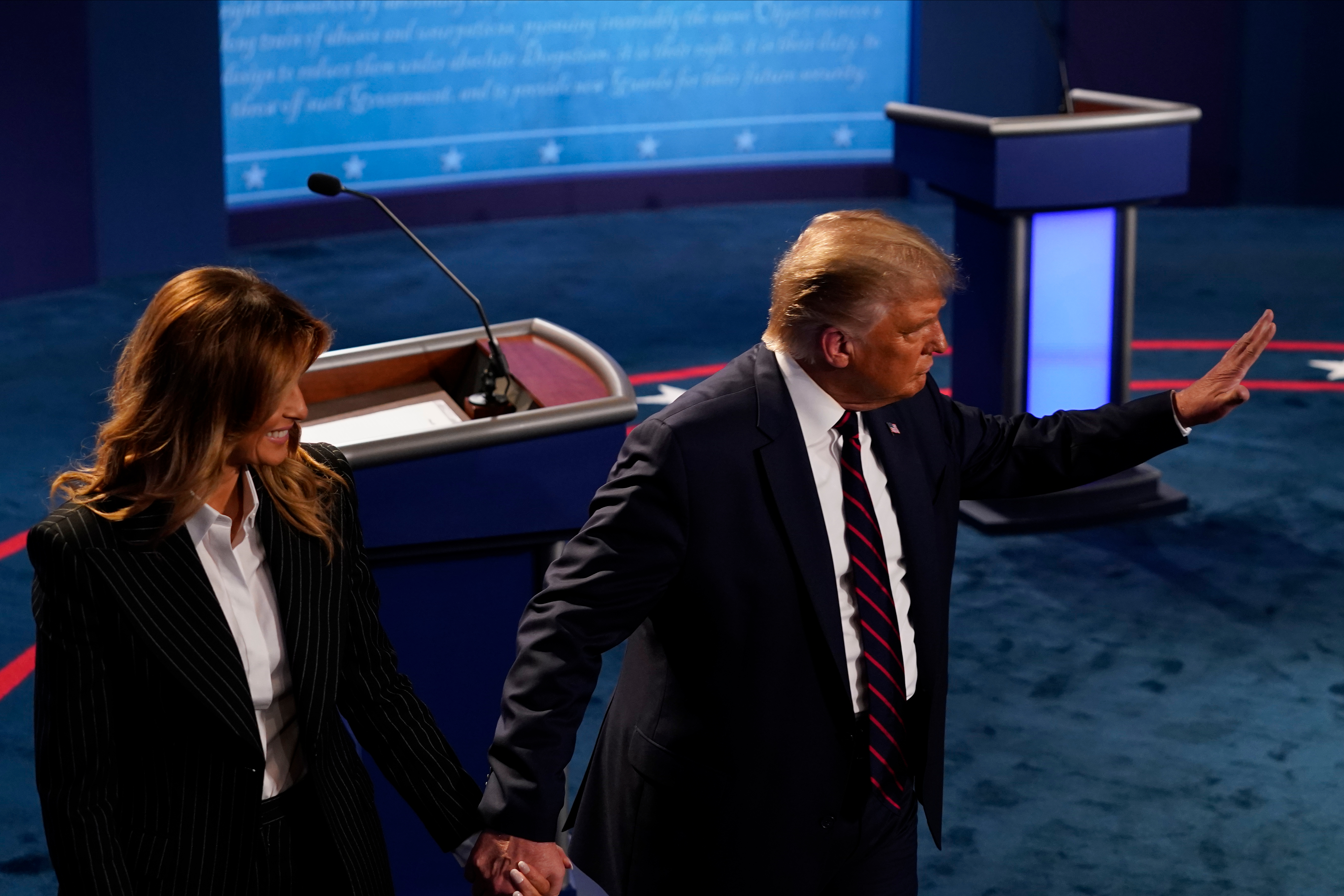 CLEVELAND, OHIO - SEPTEMBER 29: US President Donald Trump walks off the stage with his wife first lady Melania Trump after the first presidential debate at the Health Education Campus of Case Western Reserve University on September 29, 2020 in Cleveland, Ohio. This is the first of three planned debates between the two candidates in the lead up to the election on November 3. (Photo by Morry Gash-Pool/Getty Images)