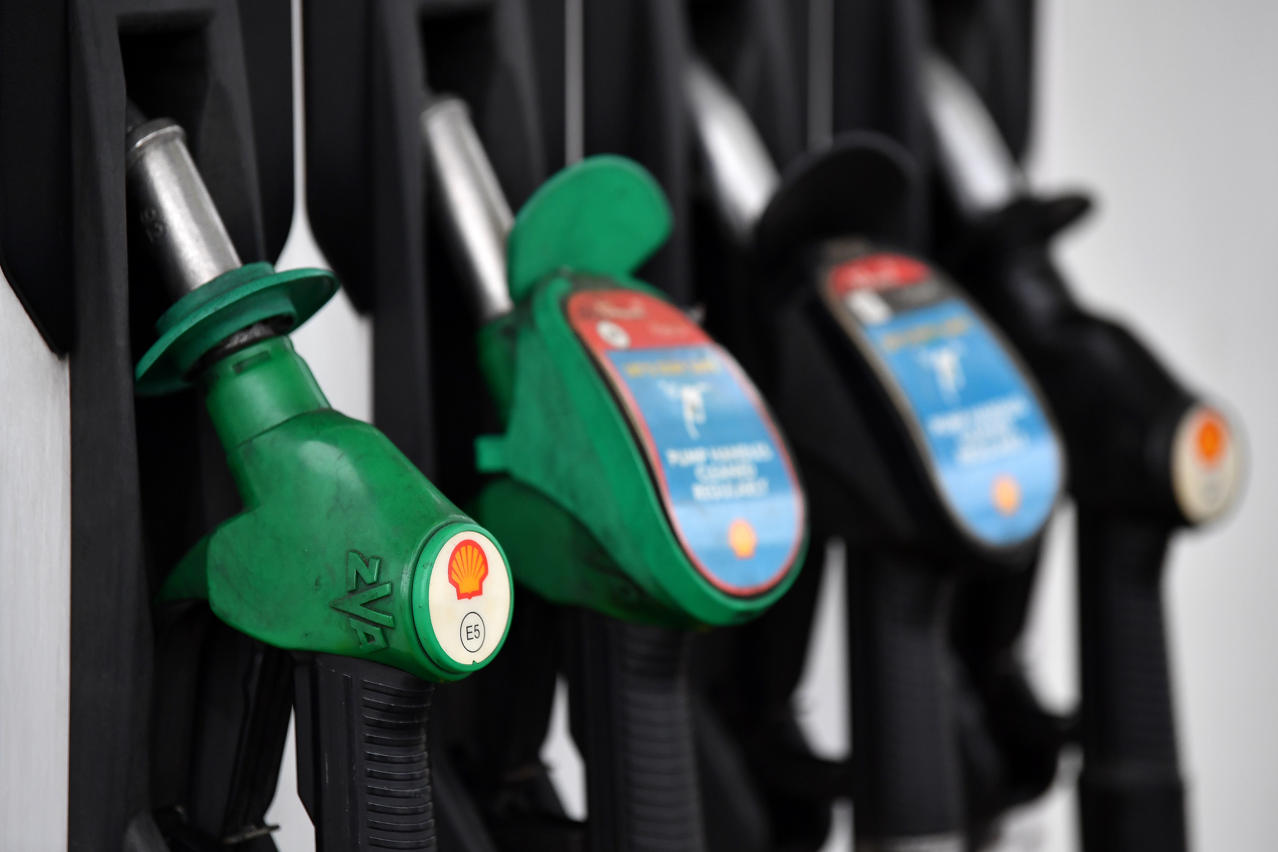 A logo is pictured on an Unleaded fuel pump at a Shell petrol station in Etlham, southeast London on September 30, 2020. - Royal Dutch Shell will axe up to 9,000 jobs or more than 10 percent of its global workforce, the energy giant said Wednesday as the coronavirus pandemic slams oil demand and prices. The Anglo-Dutch group will cut between 7,000 and 9,000 positions by the end of 2022, including 1,500 staff who have agreed to take voluntary redundancy this year, it said in a statement. (Photo by Ben STANSALL / AFP) (Photo by BEN STANSALL/AFP via Getty Images)