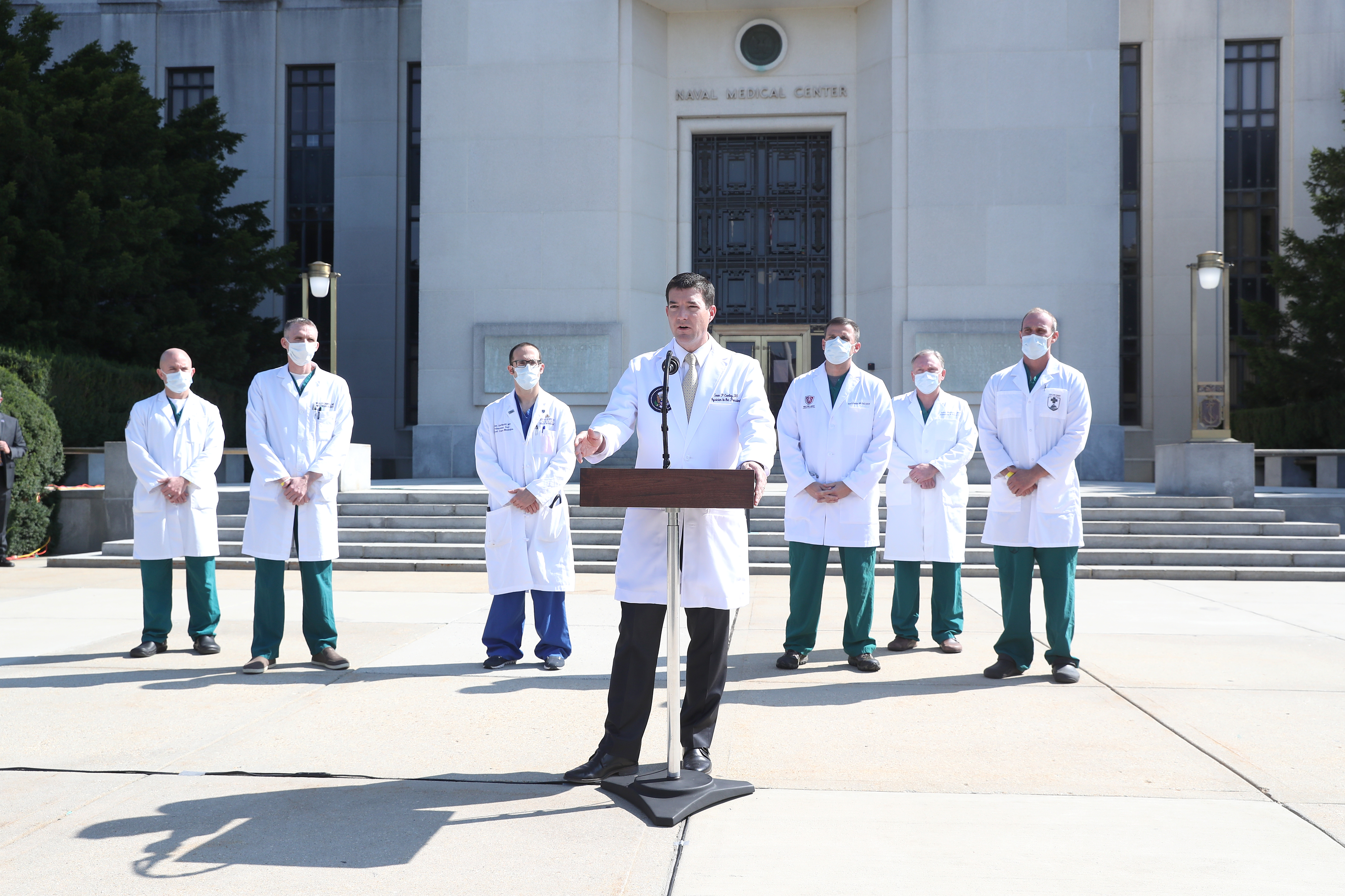 Dr. Sean Conley, White House physician, speaks during a press conference outside of Walter Reed National Military Medical Center in Bethesda, Maryland, U.S., on Sunday, Oct. 4, 2020. President Donald Trump may be discharged from the hospital as soon as Monday as he recuperates from Covid-19, one of his doctors said Sunday, though they revealed hes been administered a medicine to control inflammation. Photographer: Michael Reynolds/EPA/Bloomberg via Getty Images