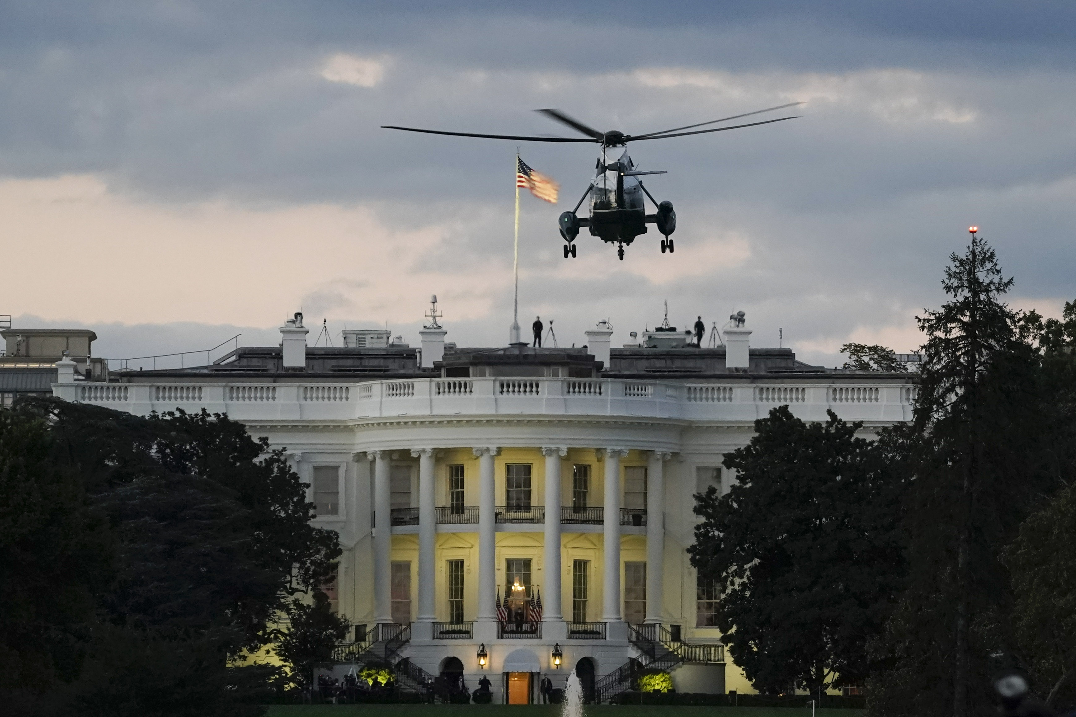 WASHINGTON, DC - OCTOBER 05: U.S. Marine One, with President Donald Trump onboard, prepares to land on the South Lawn of the White House on October 5, 2020 in Washington, DC. Trump was returning to the White House after being treated for Covid-19 at Walter Reed National Military Medical Center since Friday evening. (Photo by Drew Angerer/Getty Images)