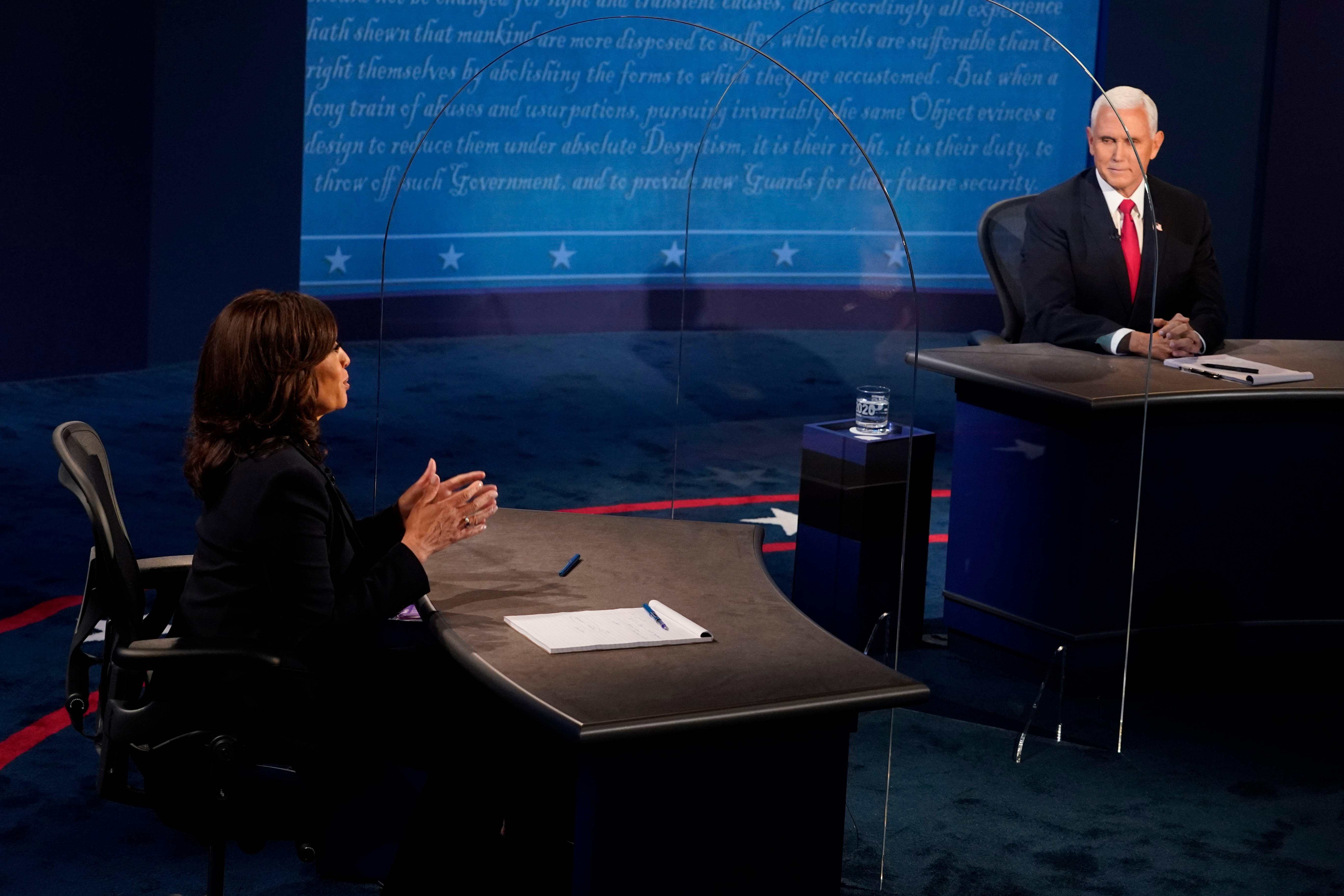 Sen. Kamala Harris, Democratic vice presidential nominee, speaks as U.S. Vice President Mike Pence, right, listens during the U.S. vice presidential debate at the University of Utah in Salt Lake City, Utah, U.S., on Wednesday, Oct. 7, 2020. Pence and Harris faced off in their first and only debate less than a month before the election, with the coronavirus adding a sudden twist to the event.