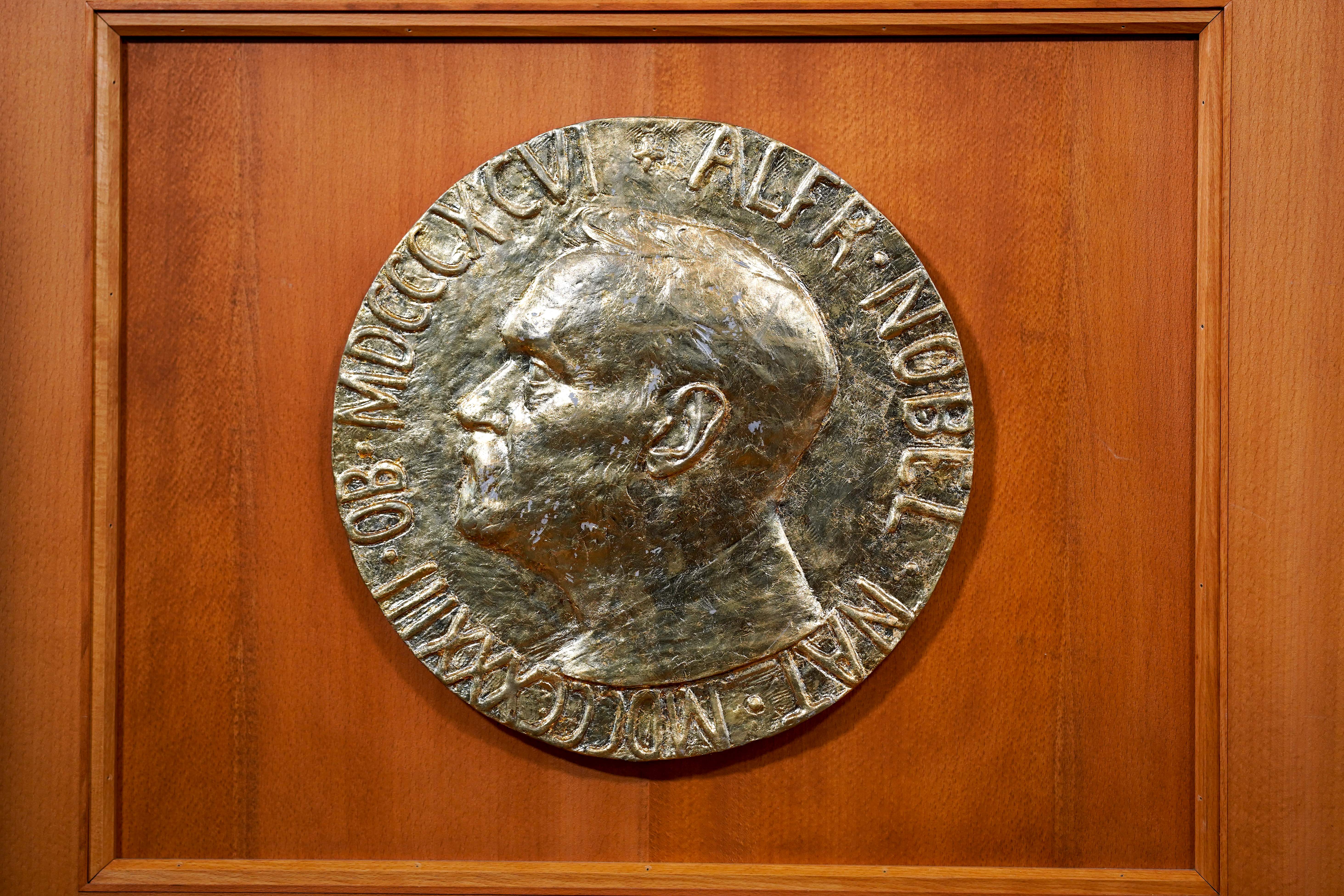 The portrait of Alfred Nobel is seen at the desk prior to the announcement of the laureates of the 2020 Nobel Peace Prize in the Nobel Institute in Oslo on October 9, 2020.