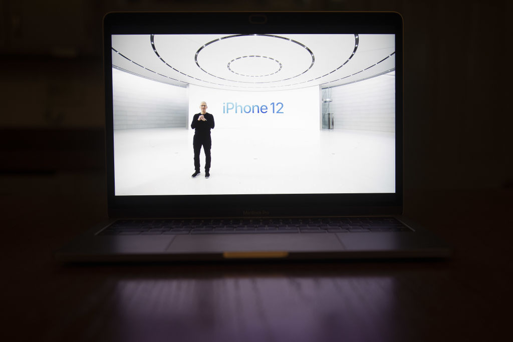 Apple CEO Tim Cook hosts a virtual product launch, as seen on a laptop computer, on Oct. 13, 2020. Apple revealed four redesigned iPhones with 5G wireless capability, upgraded cameras, faster processors, and a wider range of screen sizes.
