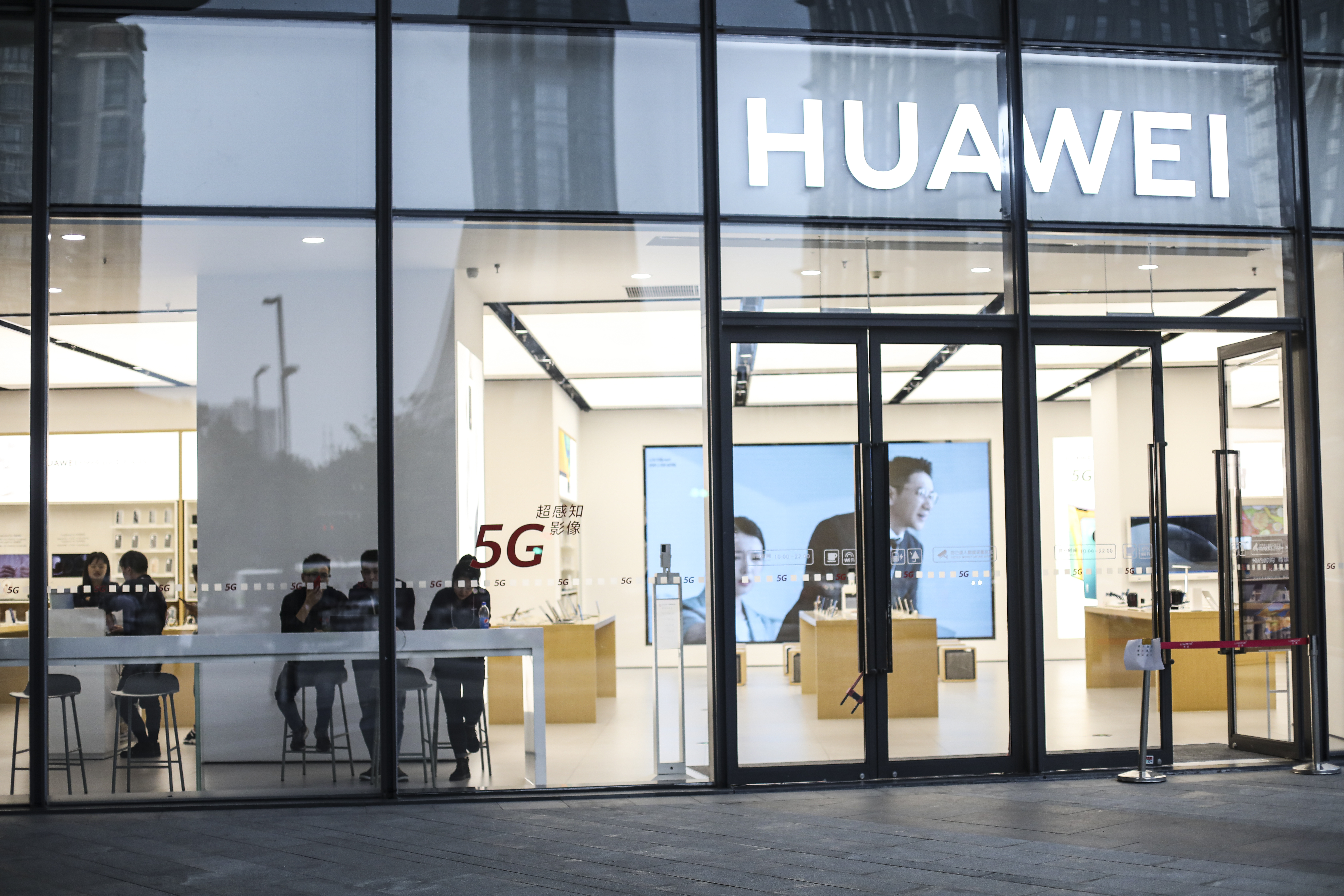 Customers at a Huawei licensed experience store on Oct. 20, 2020, in Suzhou, China.