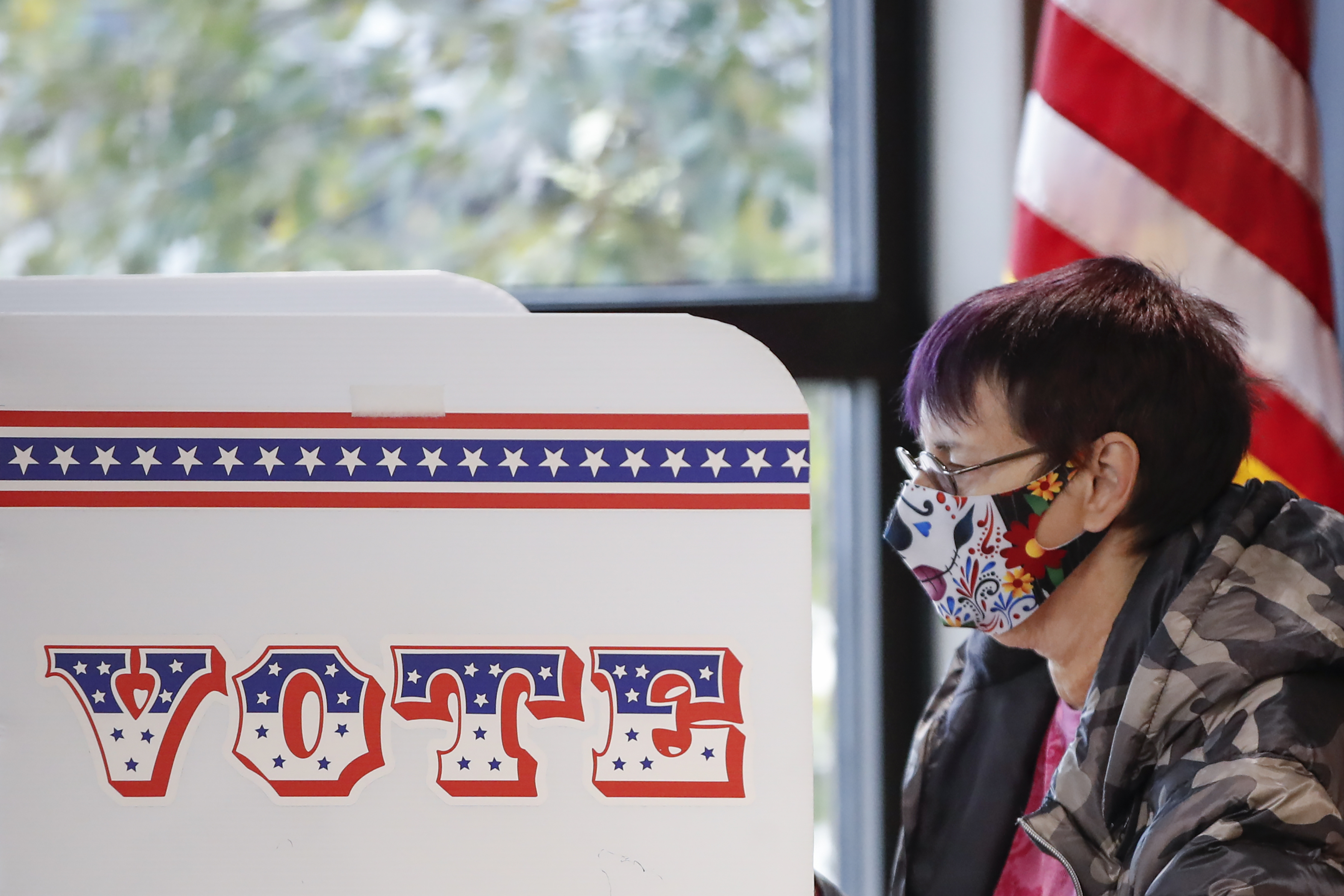 An early voter in Milwaukee. Majorities of white women have voted Republican in recent elections, but this year President Trump “has good reason to be nervous,” writes Julie Kohler.