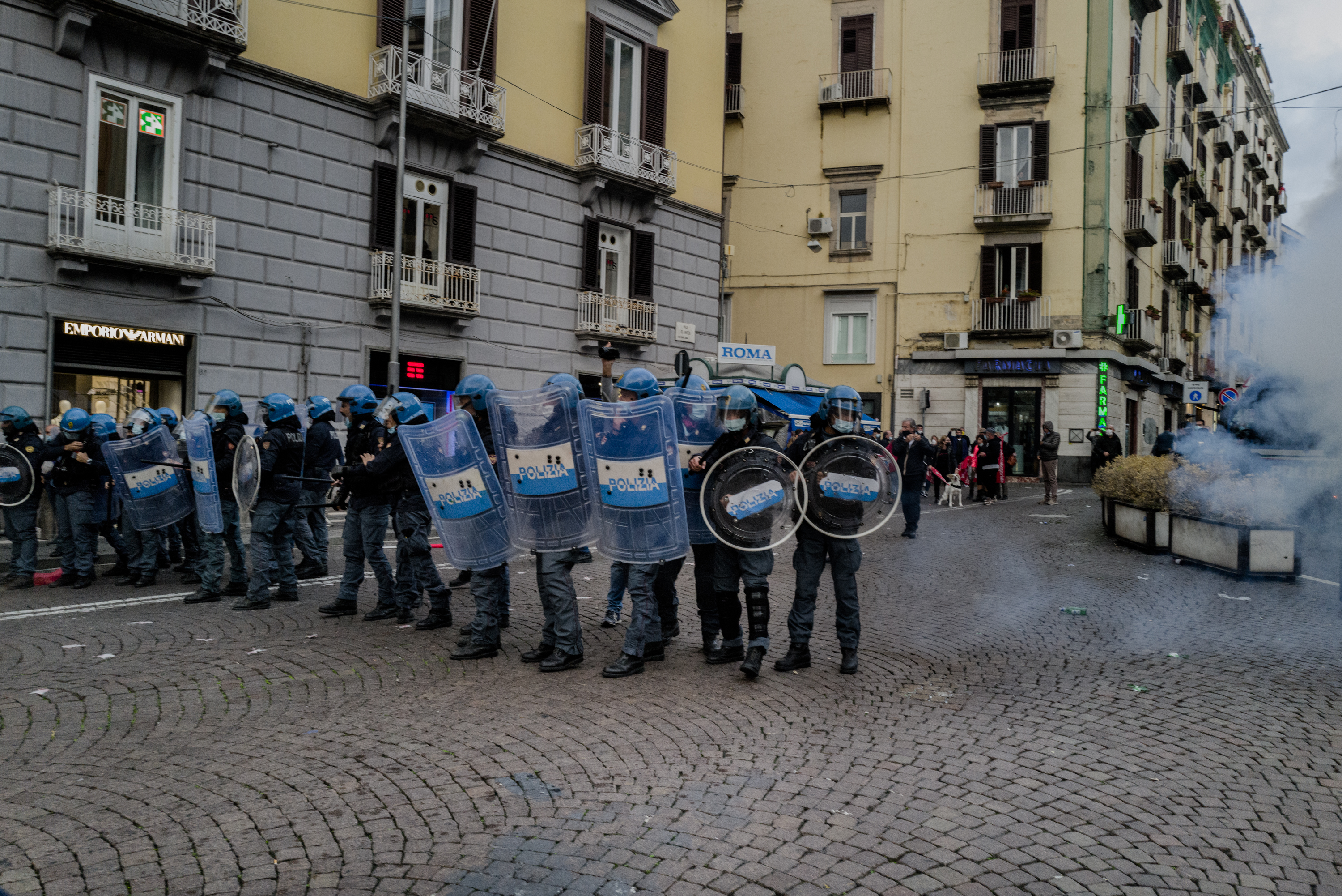 People take part in a demonstration against the COVID-19 lockdown in Naples, Italy, on October 24, 2020. The Italian region of Campania imposed a lockdown in the attempt to reduce the spread of coronavirus. Campania has already closed most of its schools and imposed a night curfew, and in the evening the police charged protesters in Naples to deny them the march of people protesting against the prospect of even tougher measures.