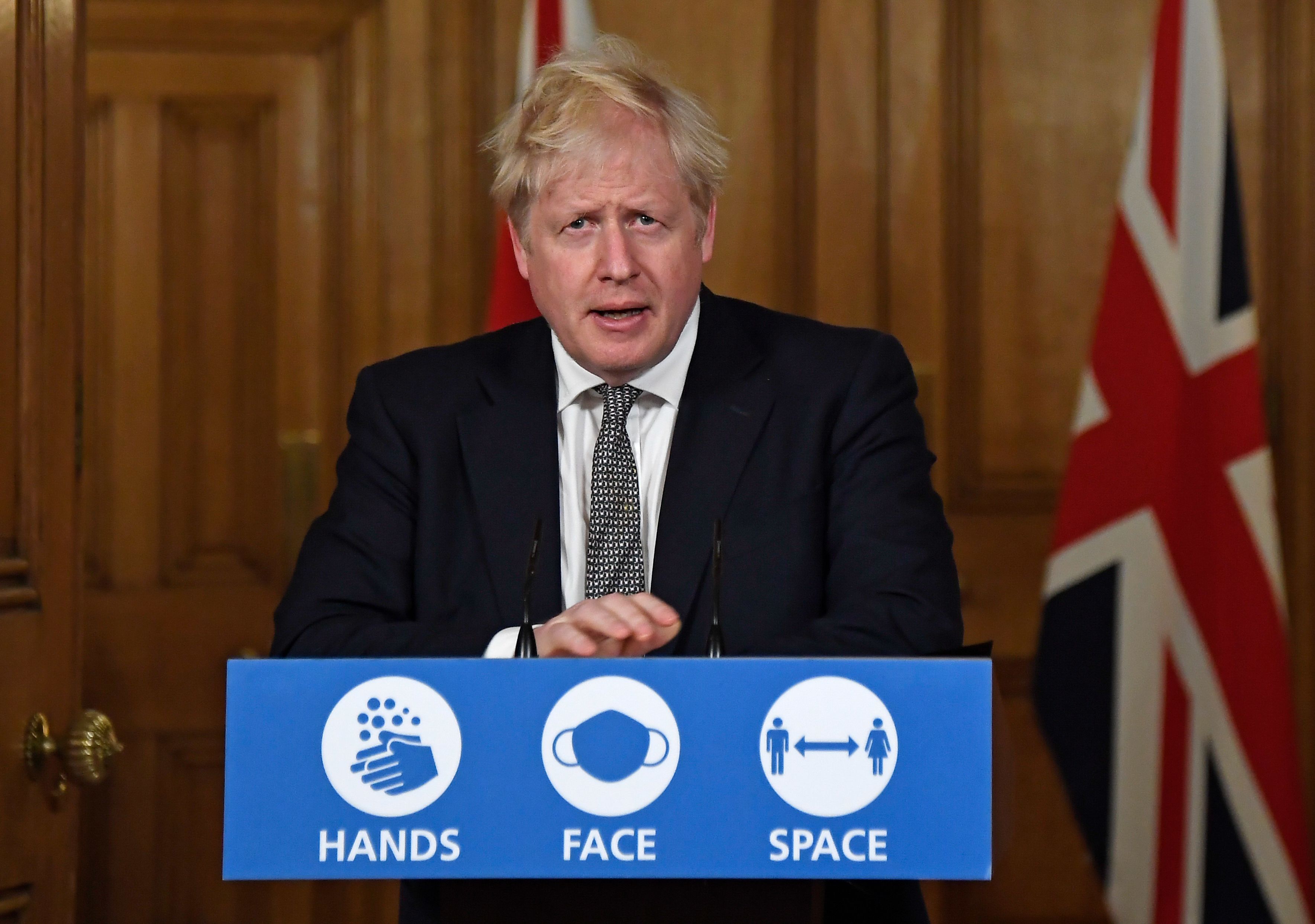 Britain's Prime Minister Boris Johnson speaks during a virtual press conference inside 10 Downing Street in central London on October 31, 2020 to announce new lockdown restrictions in an effort to curb rising infections of the novel coronavirus. - UK Prime Minister Boris Johnson on Saturday announced a new four-week coronavirus lockdown across England, a dramatic strategy shift following warnings hospitals would become overwhelmed under his current system of localised restrictions. (Photo by Alberto Pezzali / POOL / AFP) (Photo by ALBERTO PEZZALI/POOL/AFP via Getty Images)