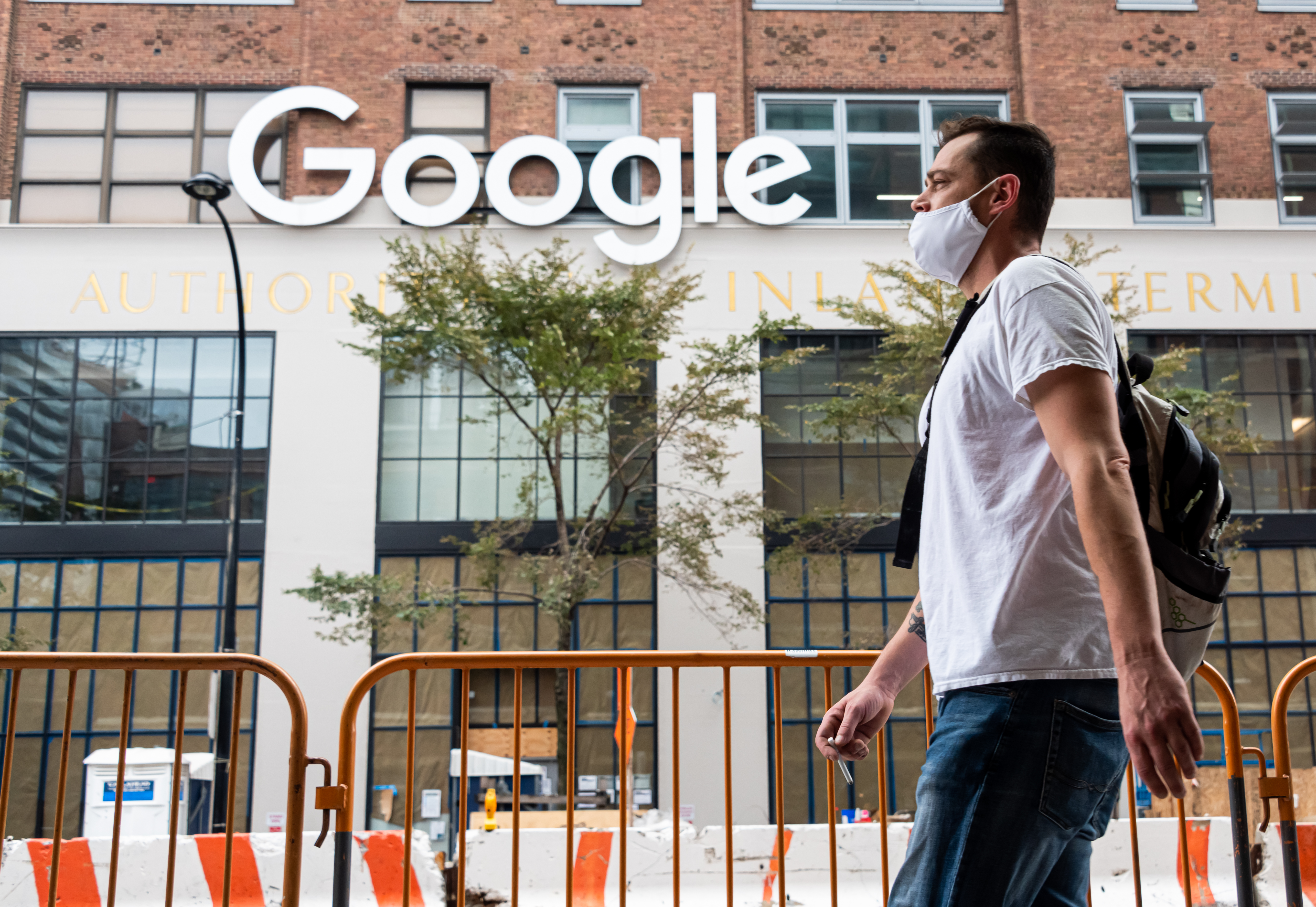 A person wears a face mask outside Google's offices in New York City on Sept. 29, 2020.